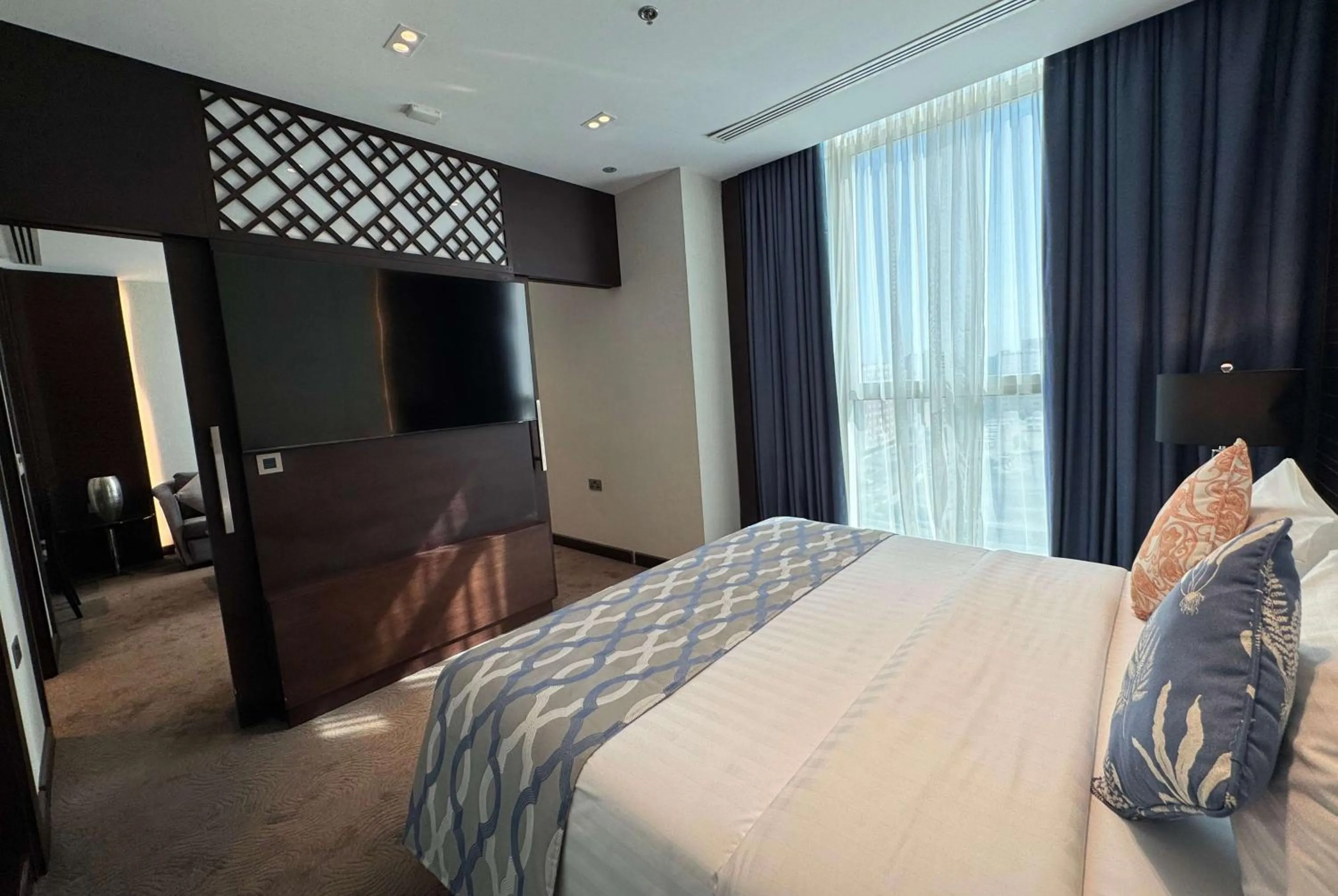 Photo of the whole room, Bed in Ramada Encore Doha by Wyndham