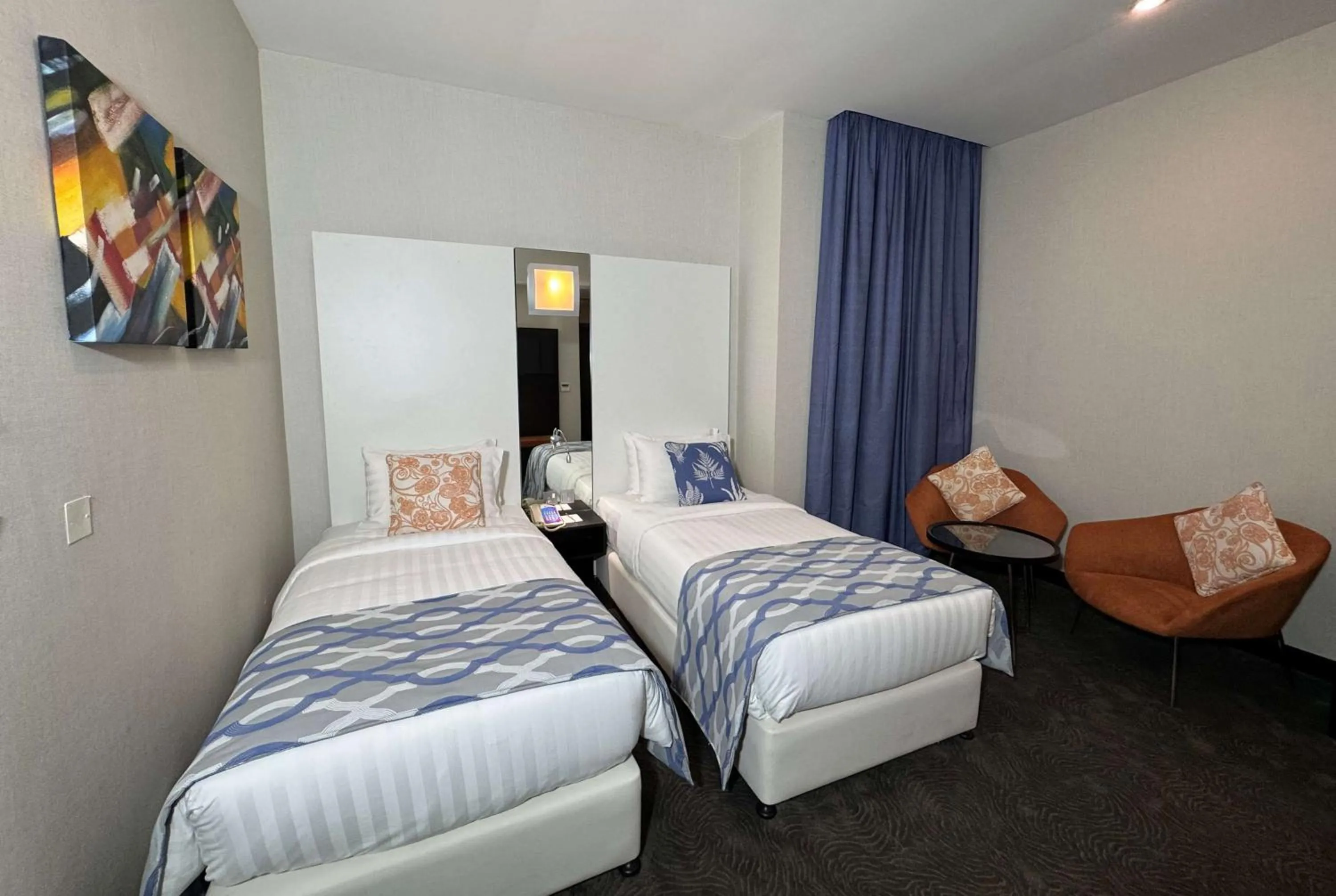 Photo of the whole room, Bed in Ramada Encore Doha by Wyndham