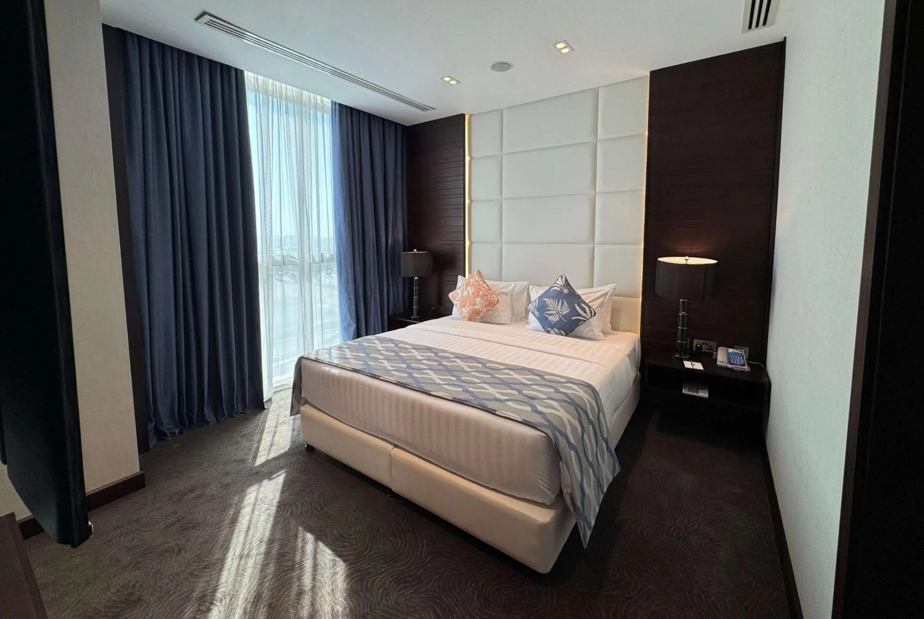 Photo of the whole room, Bed in Ramada Encore Doha by Wyndham