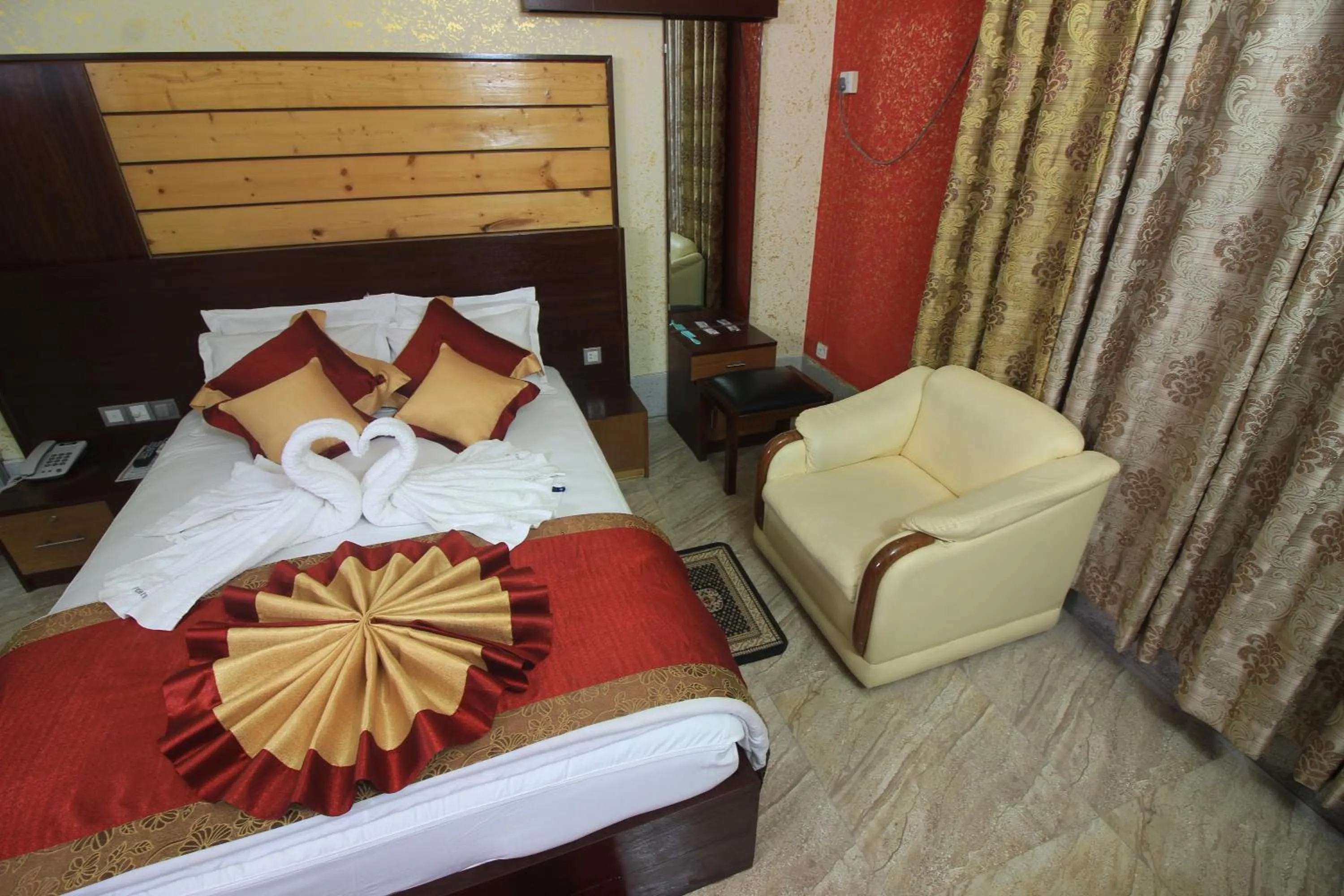 Bed in Tiger Garden Int Hotel