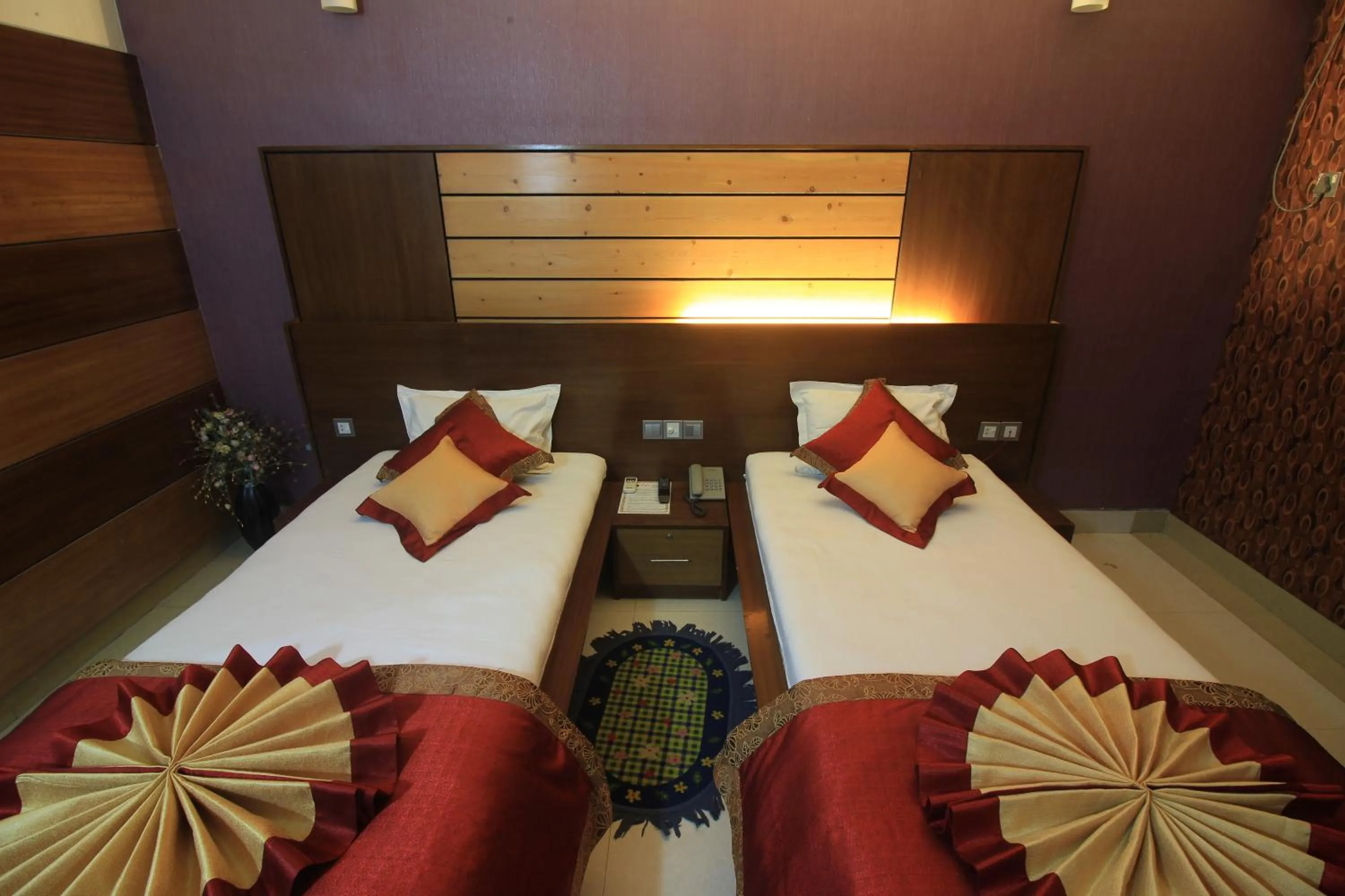 Bed in Tiger Garden Int Hotel