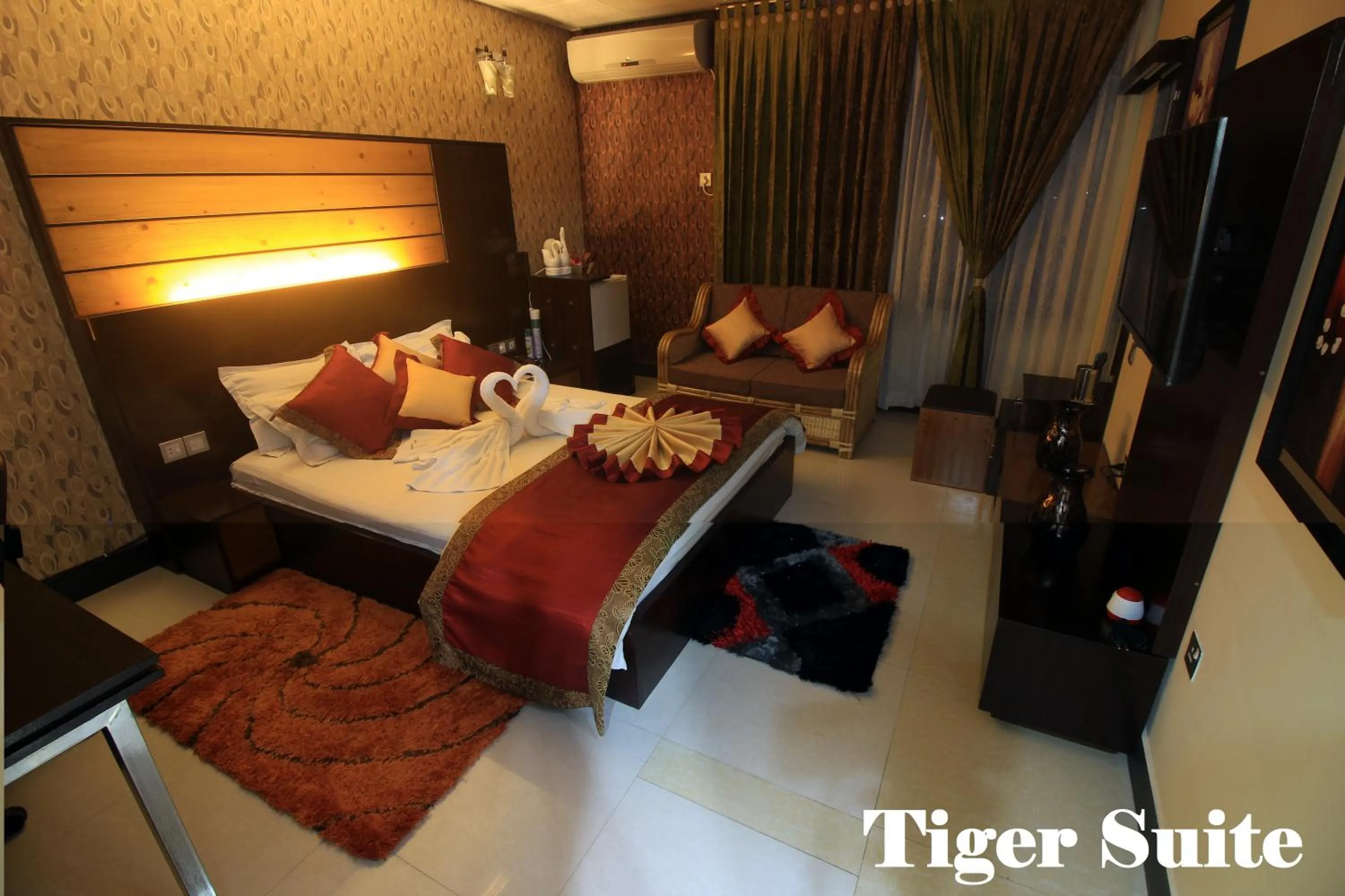 Bed in Tiger Garden Int Hotel