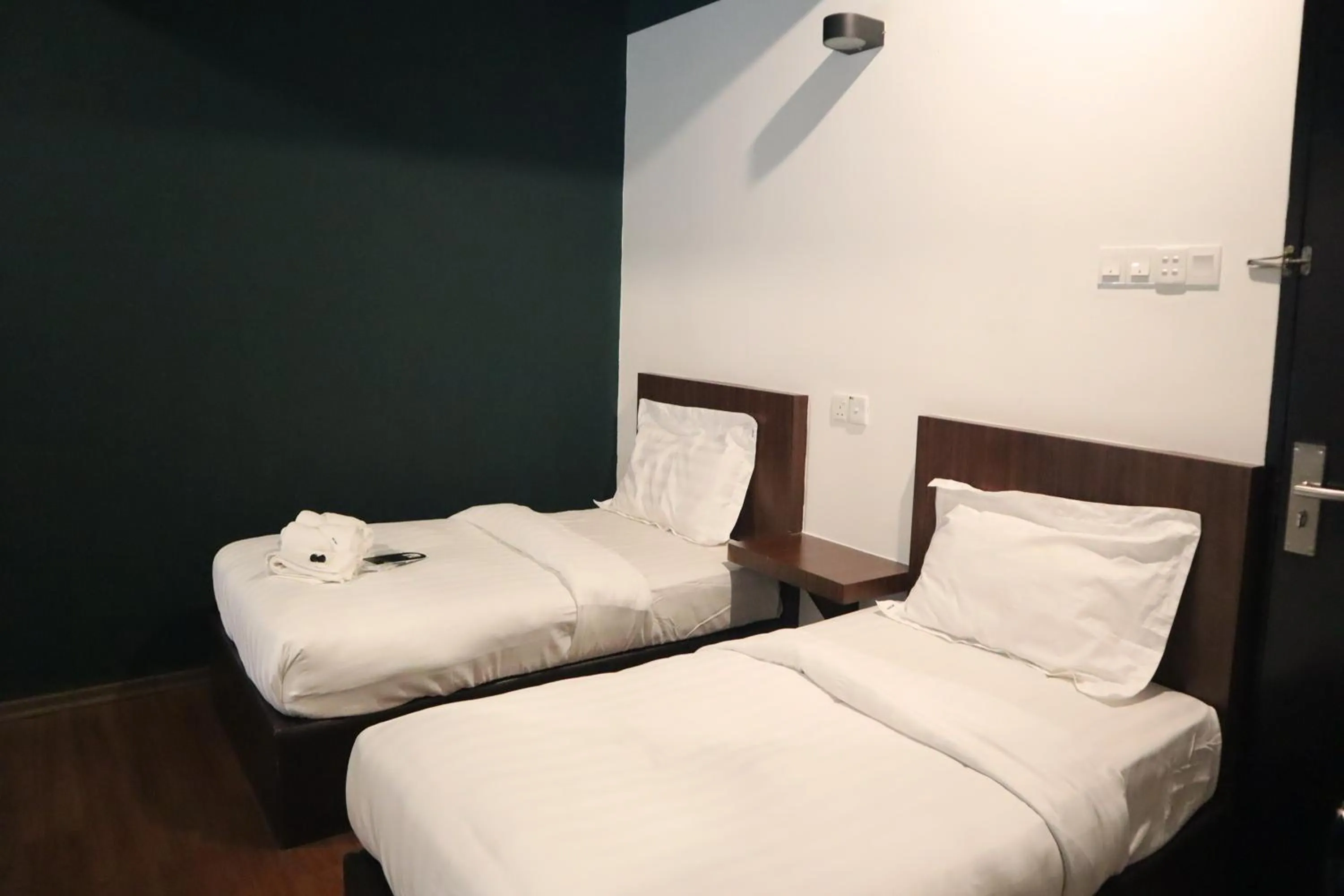 Bed in Room V at Kluang Parade Near Bus Stop Kluang