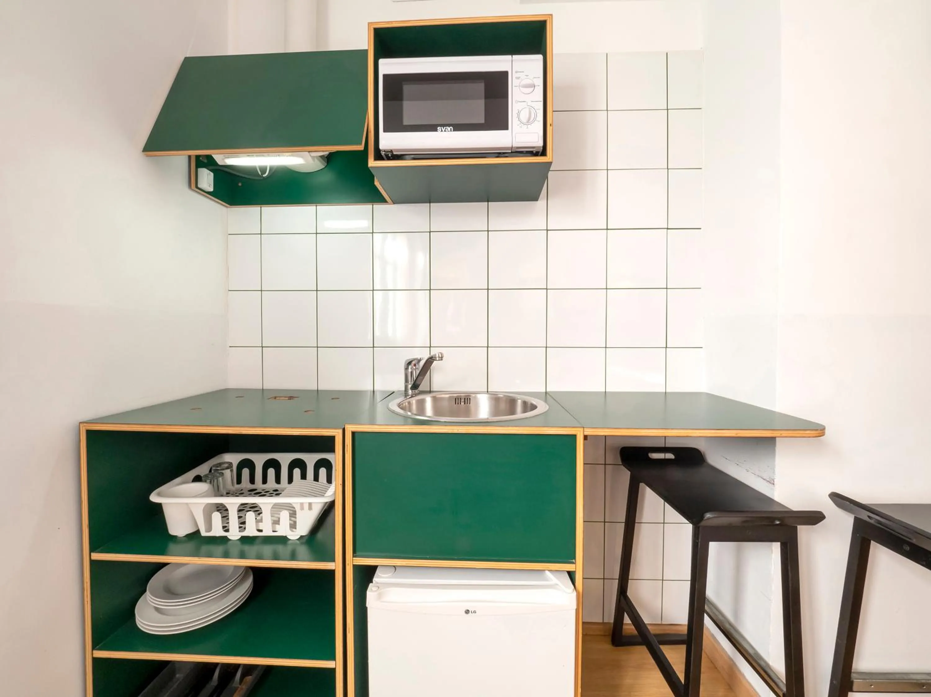 Kitchen or kitchenette in Hostal Athenas