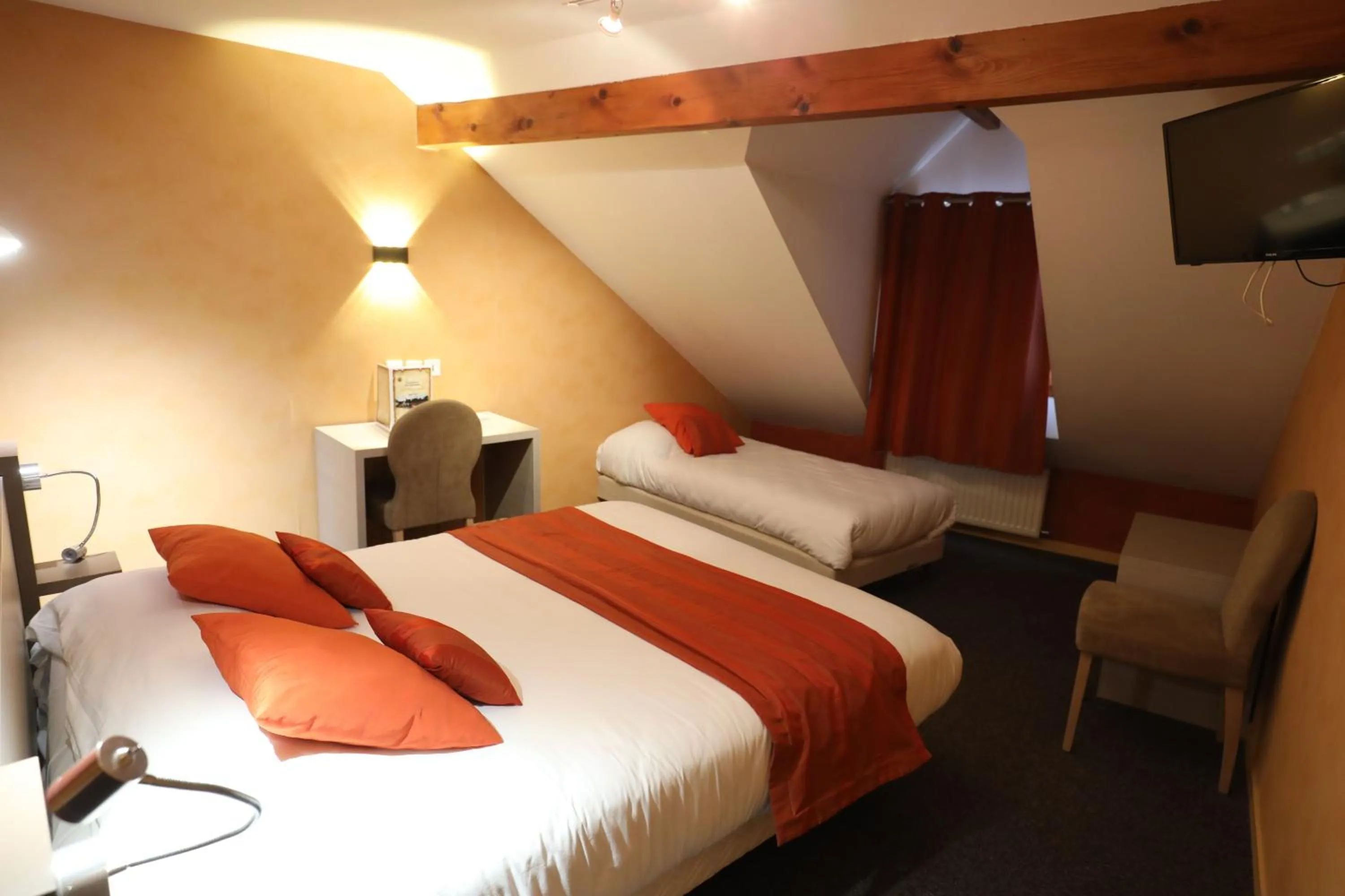 Bed in Logis Le Bourguignon