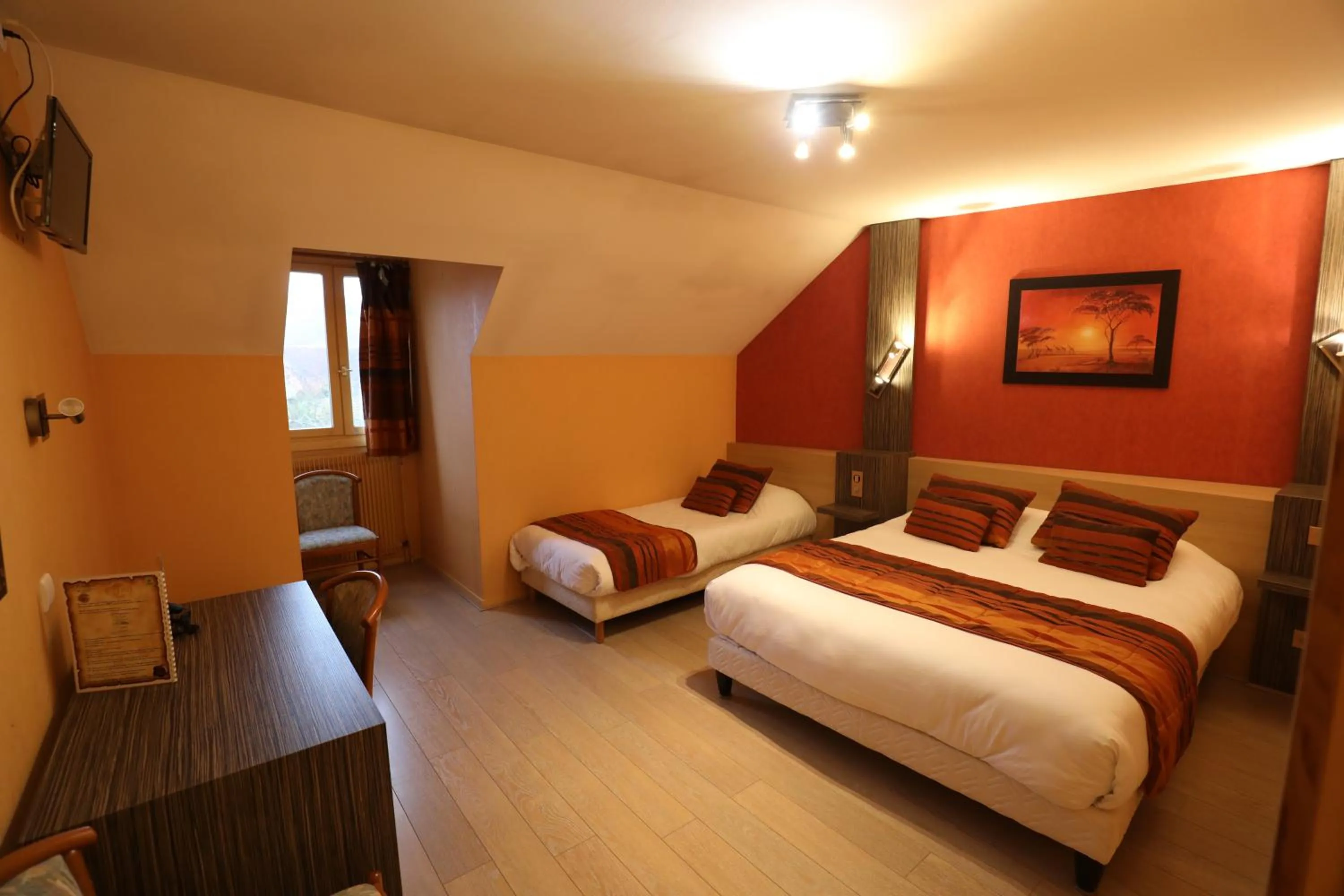 Bed in Logis Le Bourguignon