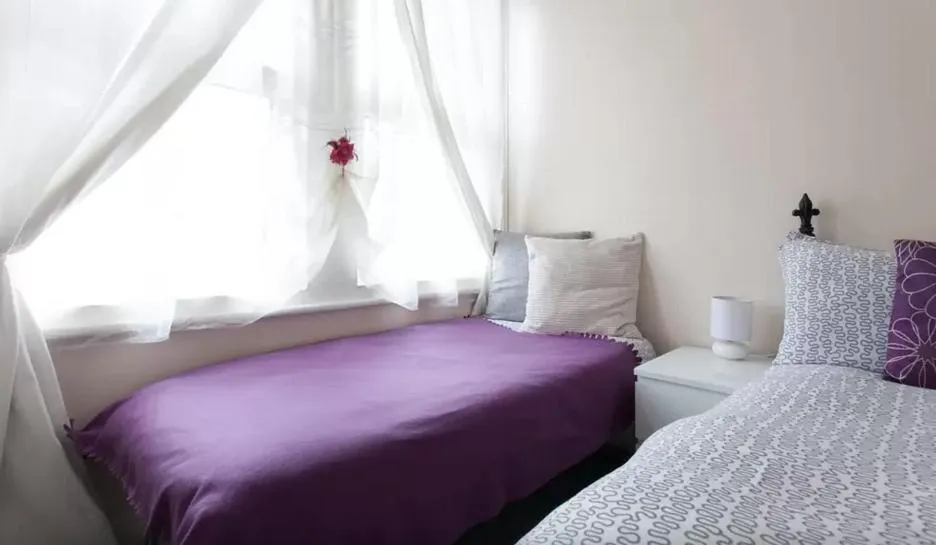 Bed in Home2Home-Rooms