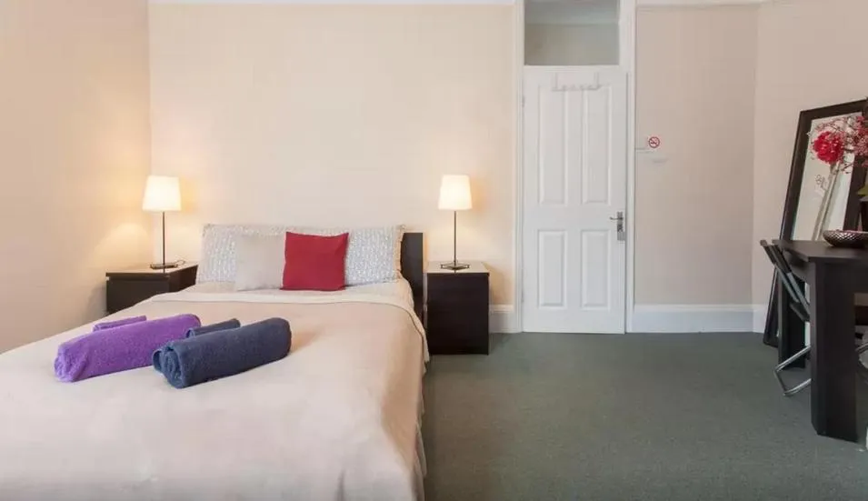 Bed in Home2Home-Rooms