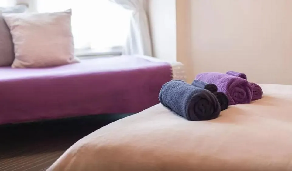 Bed in Home2Home-Rooms