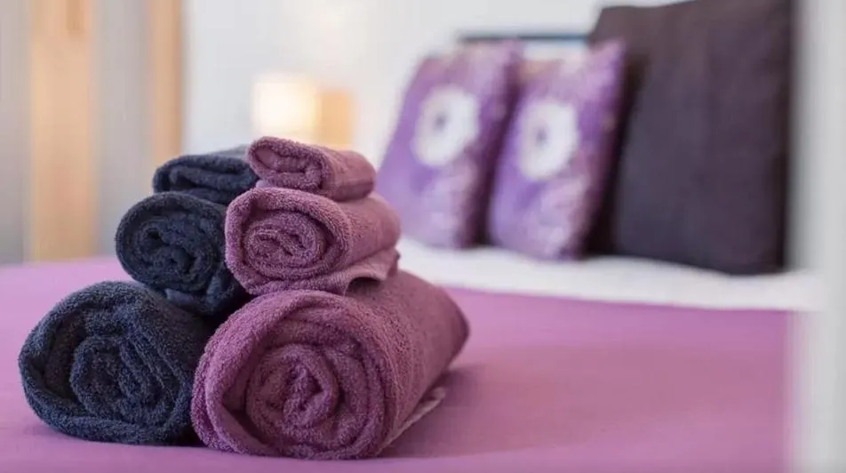 Bed in Home2Home-Rooms