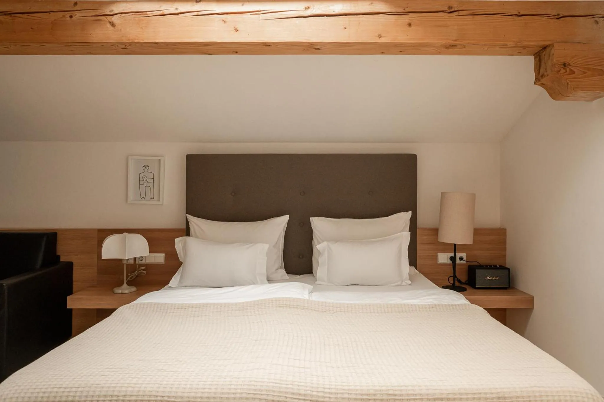 Bed in Hotel Schwarzschmied, a Member of Design Hotels