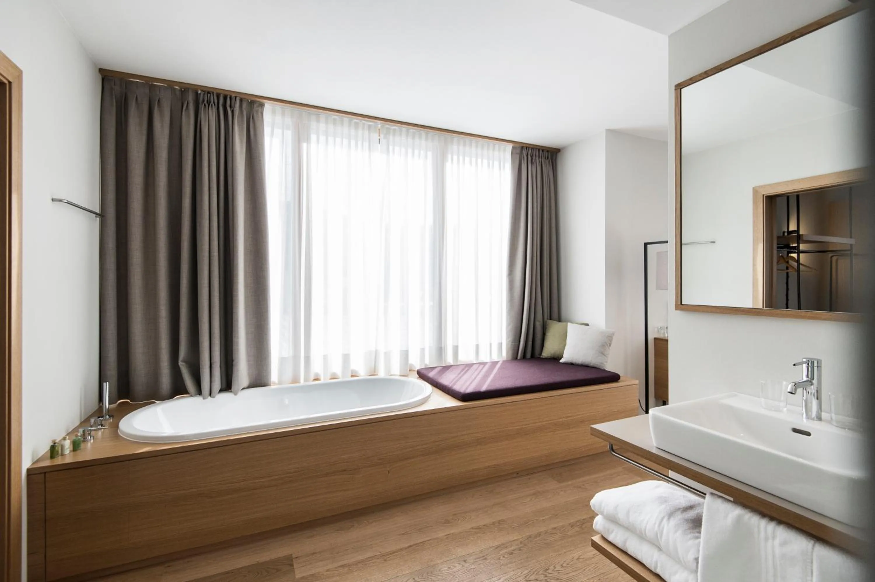Bathroom, Bed in Hotel Schwarzschmied, a Member of Design Hotels