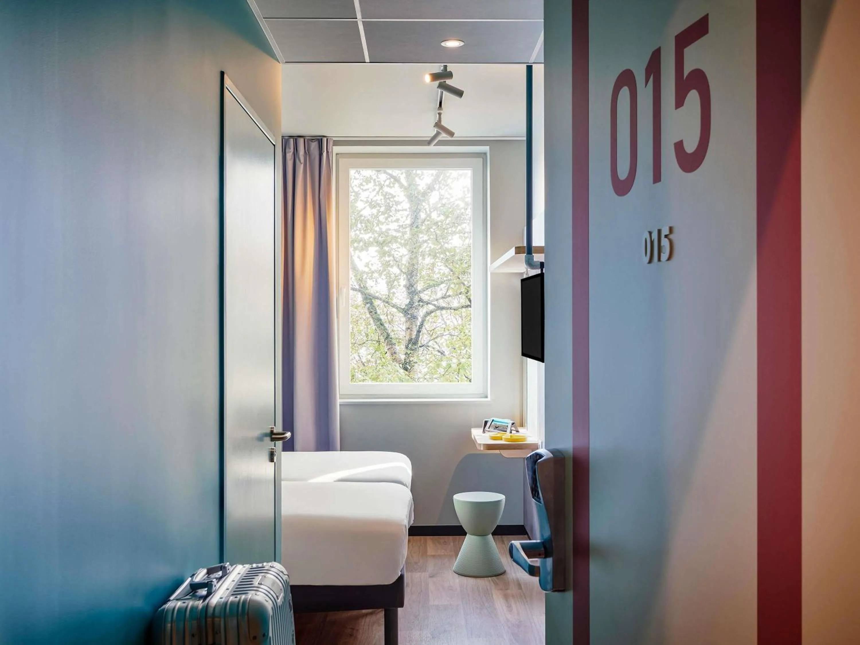 Bedroom in Ibis Budget Cergy St Christophe