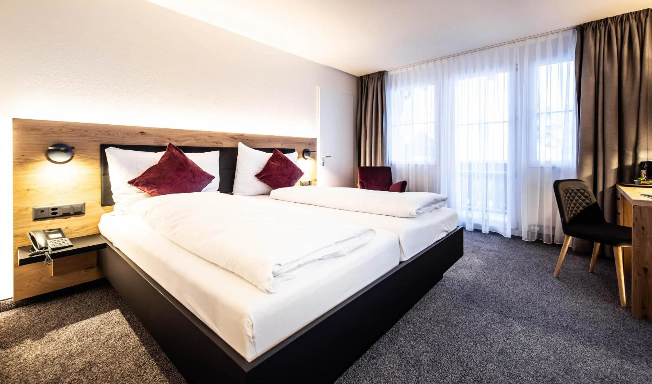 Bed in Alpenhotel Schlüssel