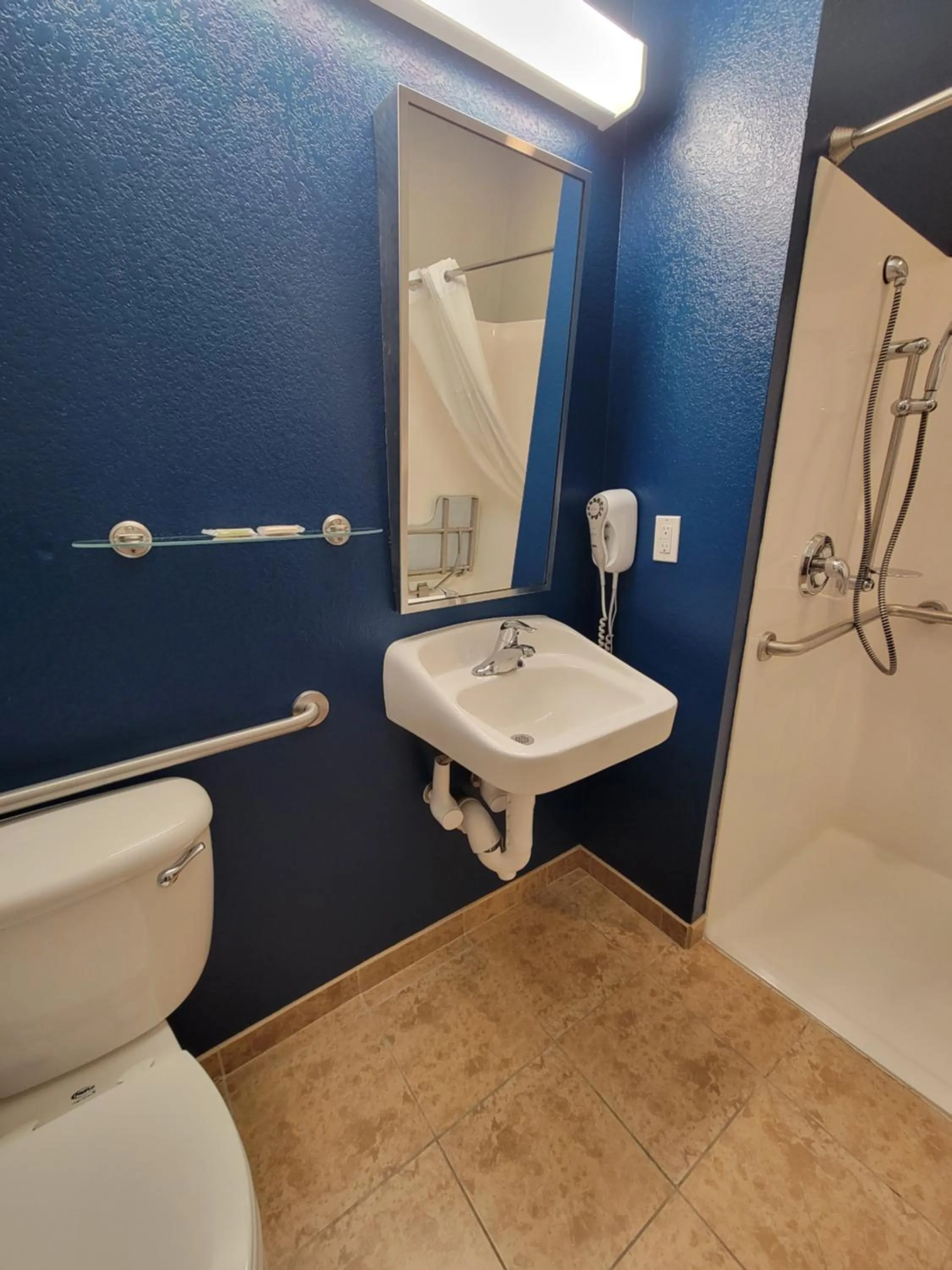 Toilet in Microtel Inn & Suites by Wyndham Bluffs