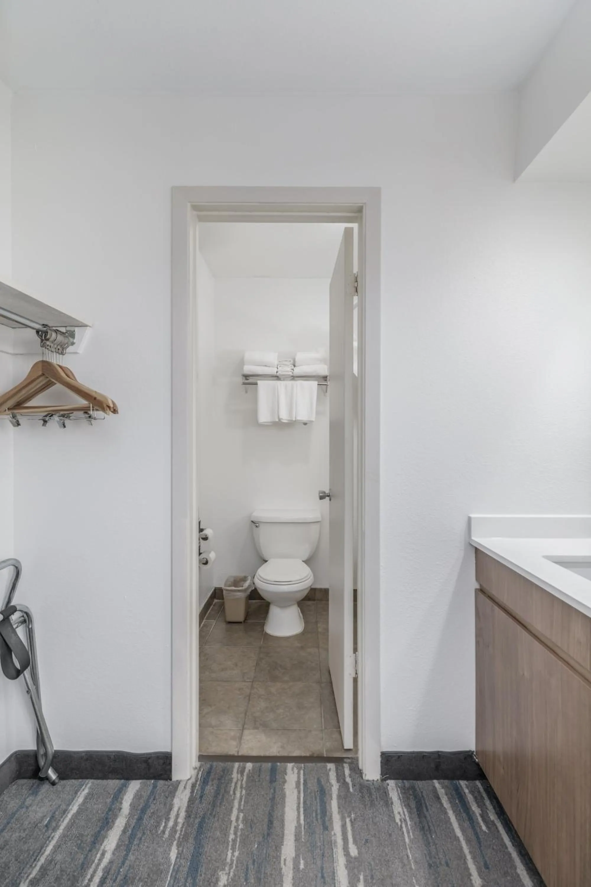 Toilet in Crossroads Inn & Suites