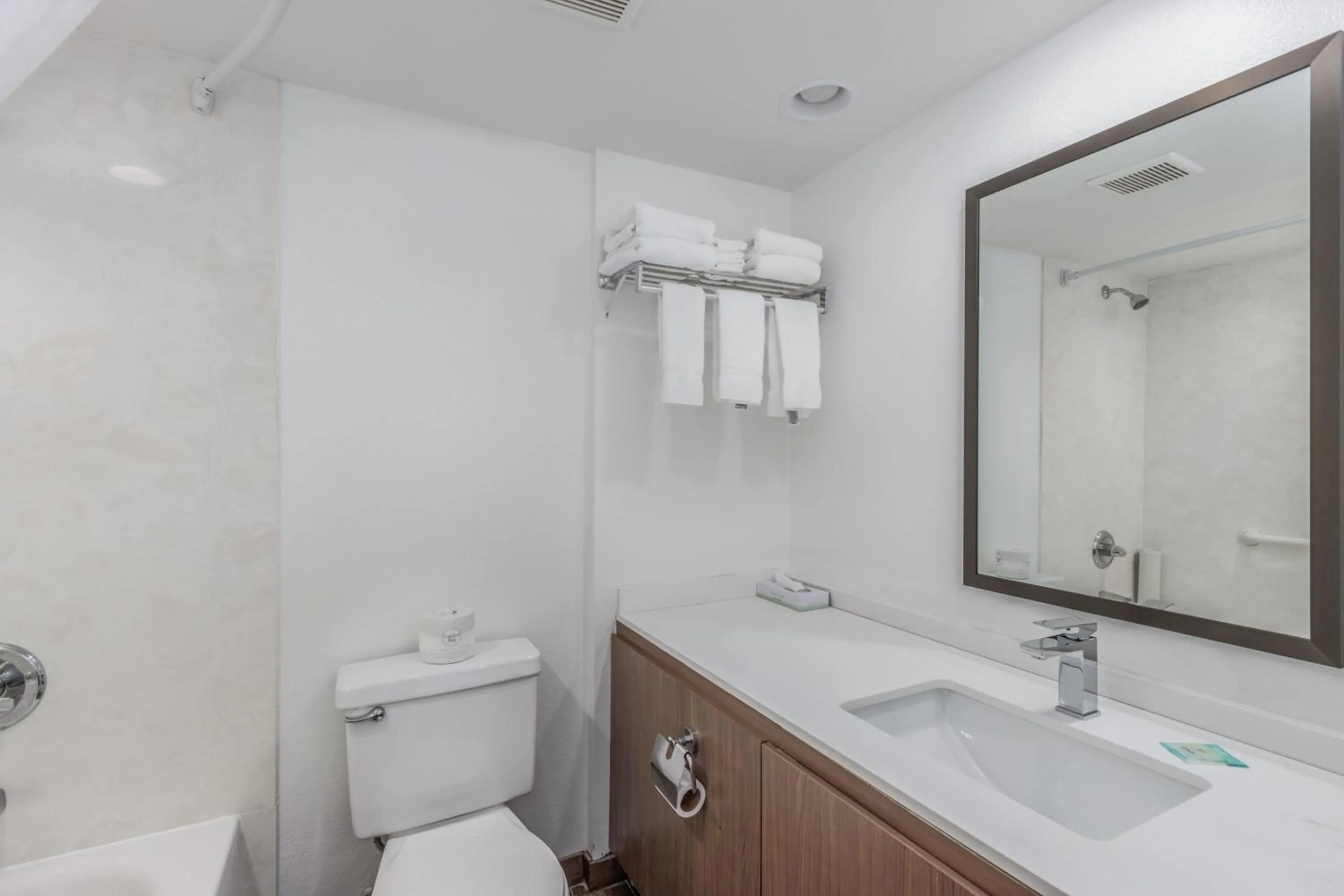 Toilet in Crossroads Inn & Suites