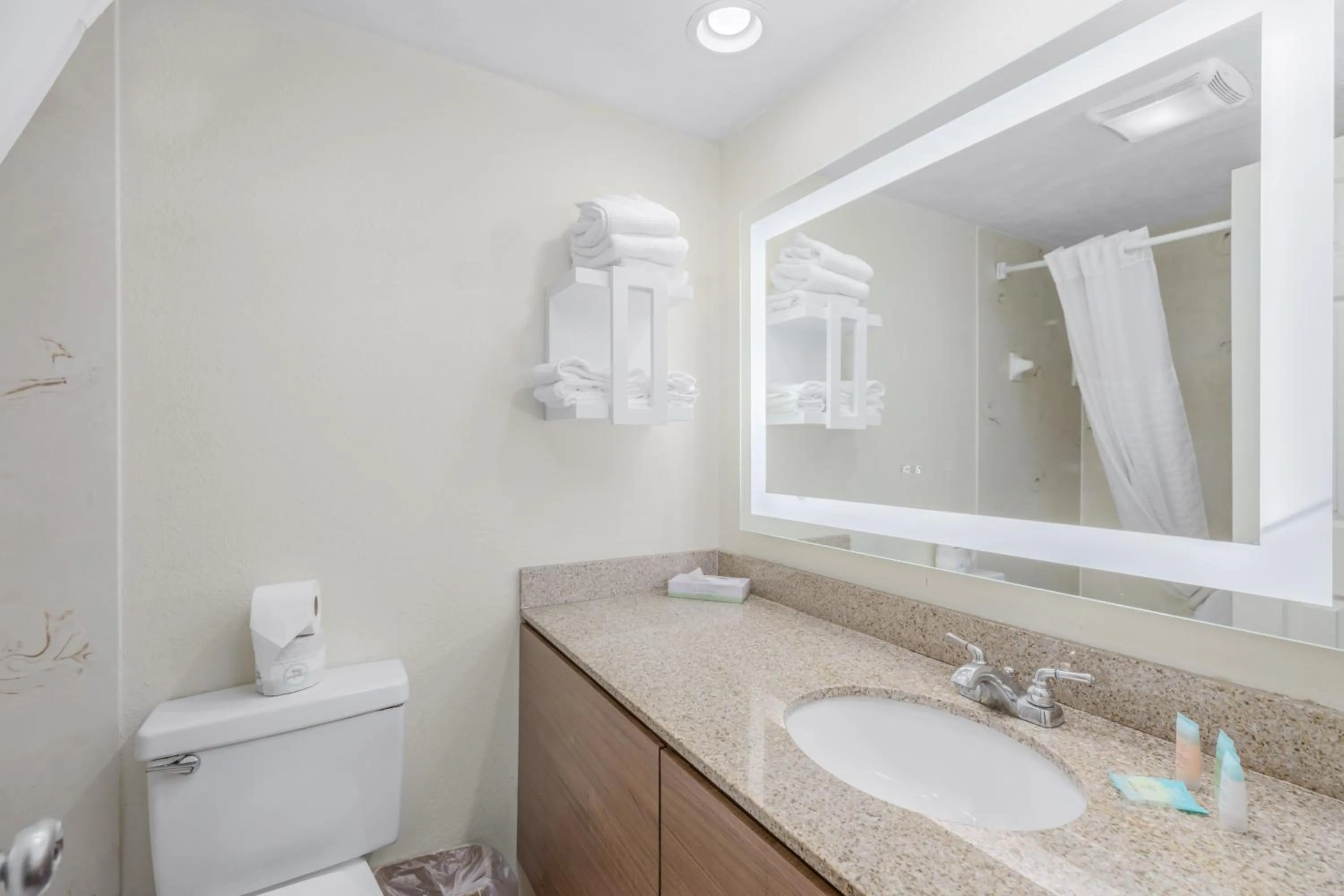 Toilet in Crossroads Inn & Suites