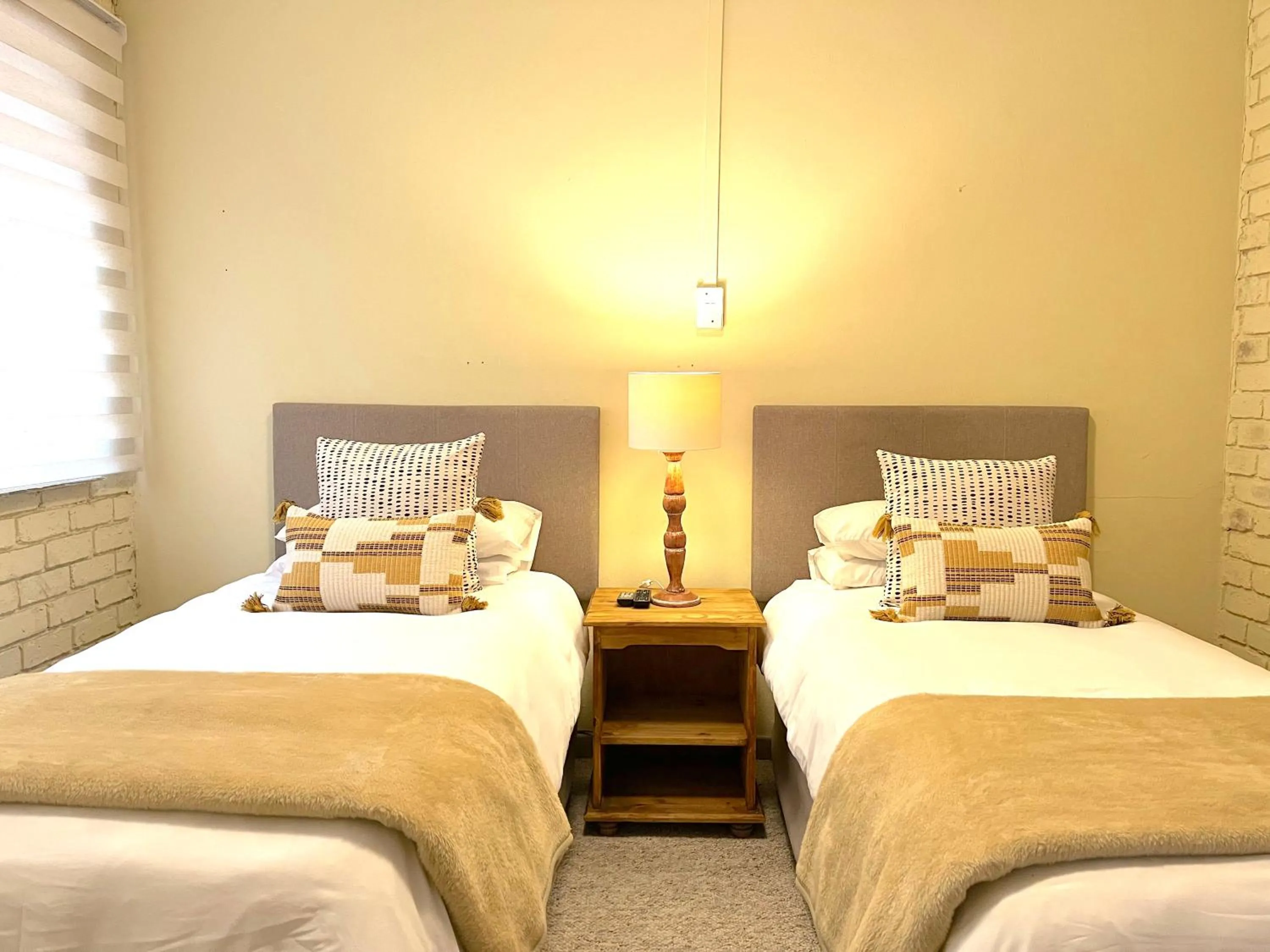 Photo of the whole room, Bed in Safari Club Guest Lodge OR Tambo International Airport