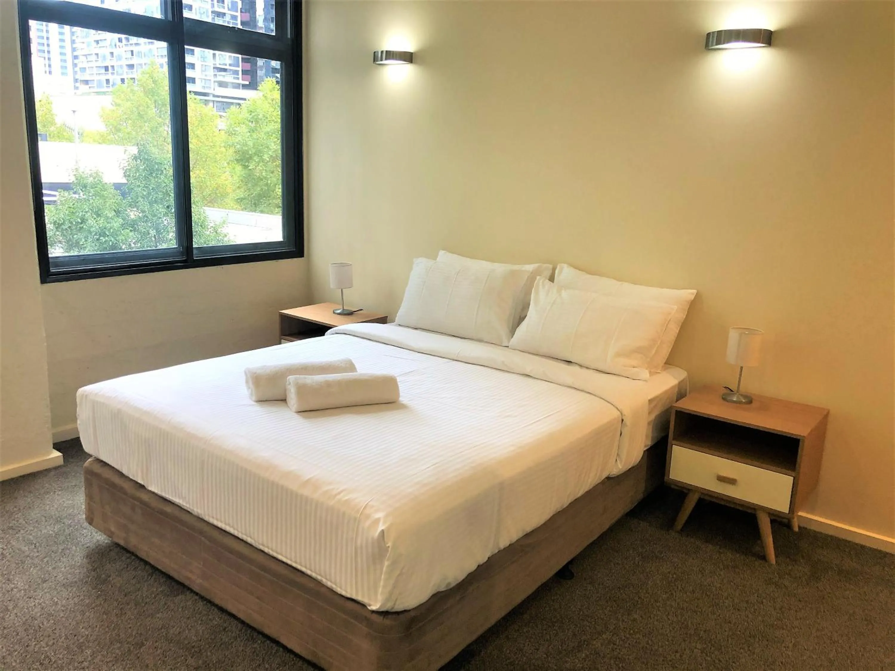 Bed in ReadySet Apartments on King