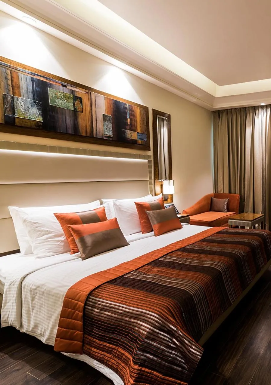 Photo of the whole room, Bed in Ramada Gurgaon Central