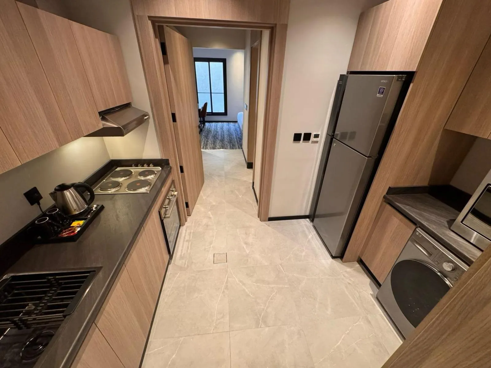 kitchen in Manazel Aldiafah serviced Apartments AlSulymaniyah