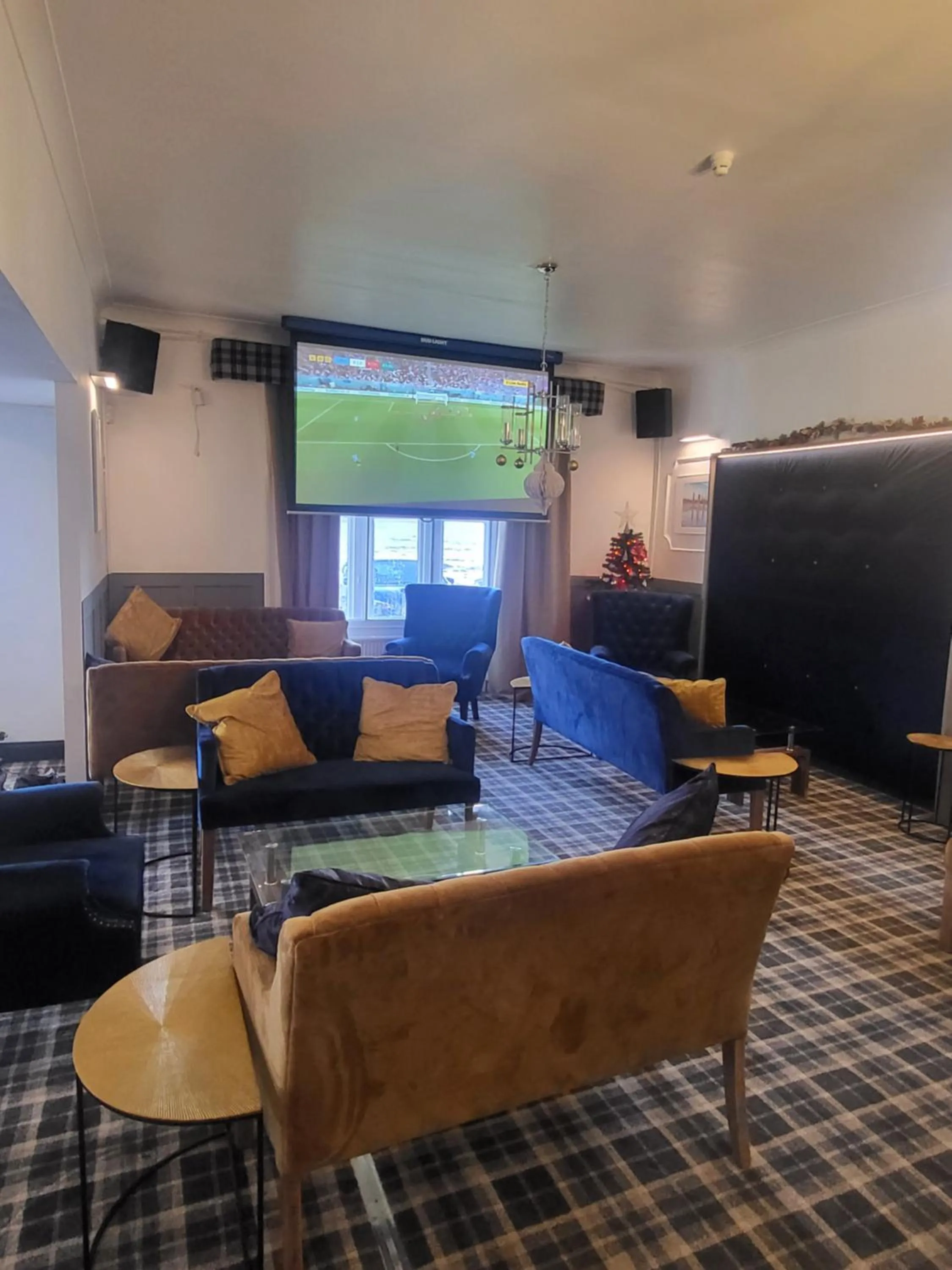 Communal lounge/ TV room in The Grey Gull Hotel