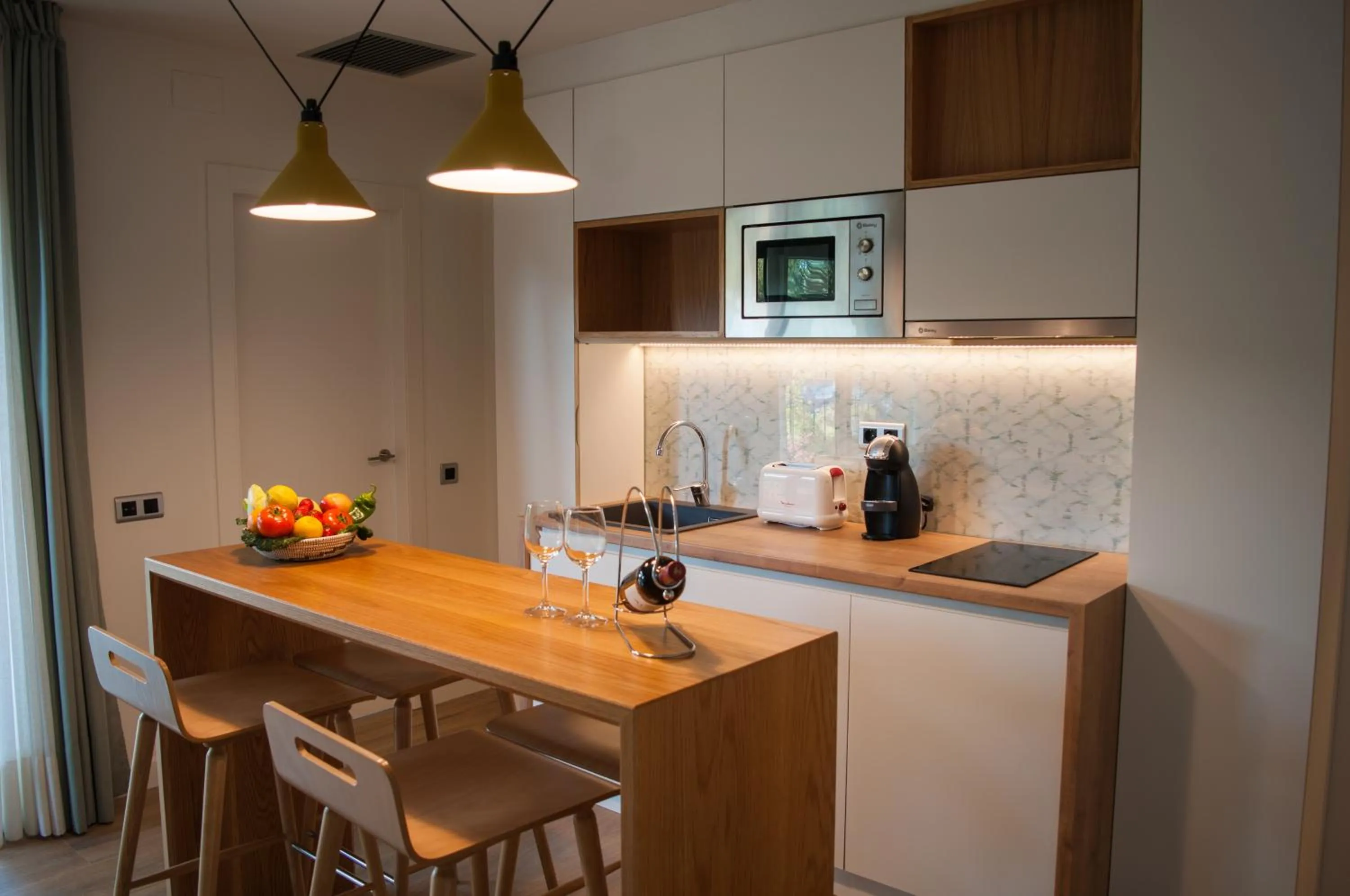 Kitchen or kitchenette in Apartamentos Porta Coeli