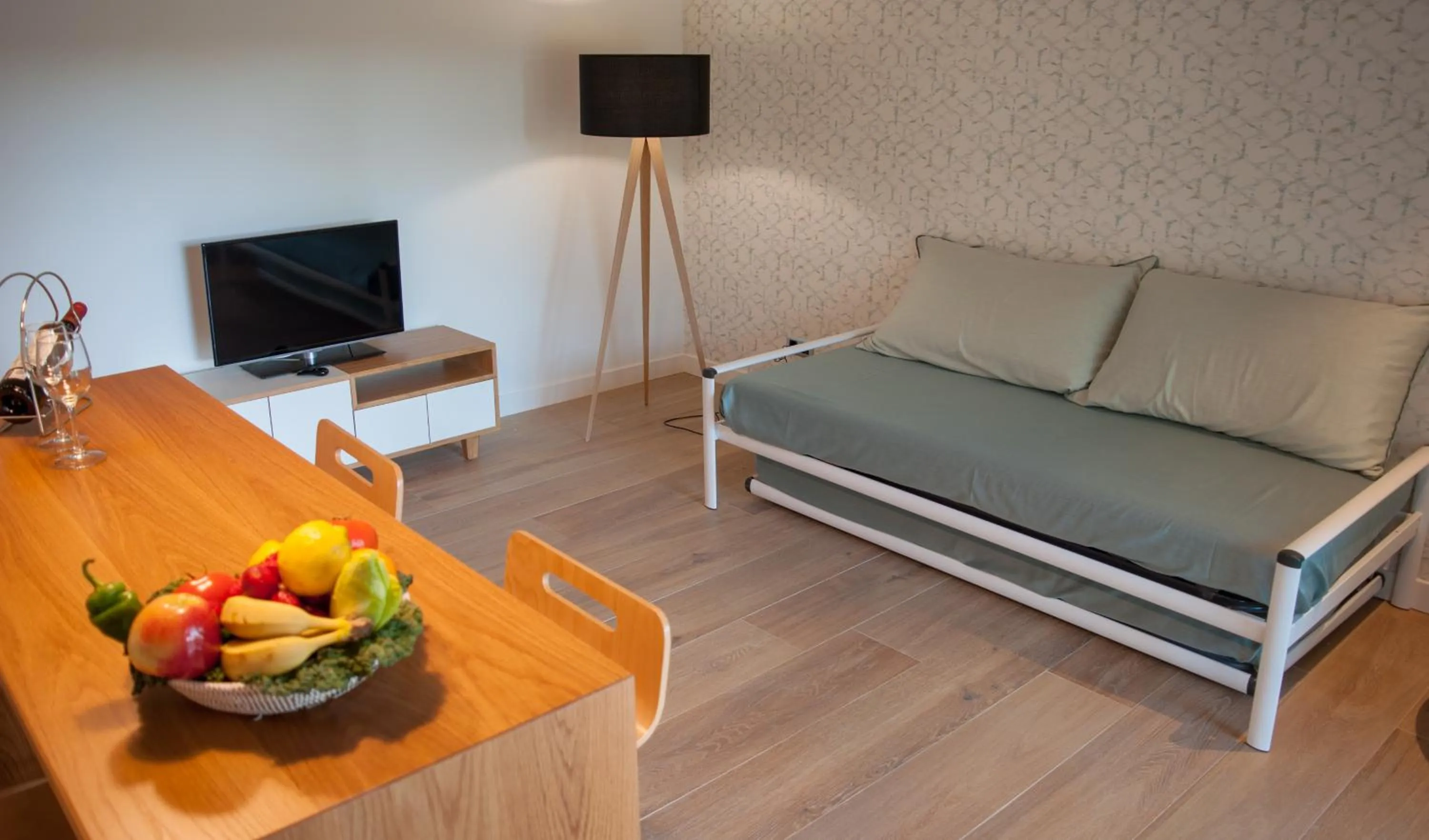 Living room, Bed in Apartamentos Porta Coeli