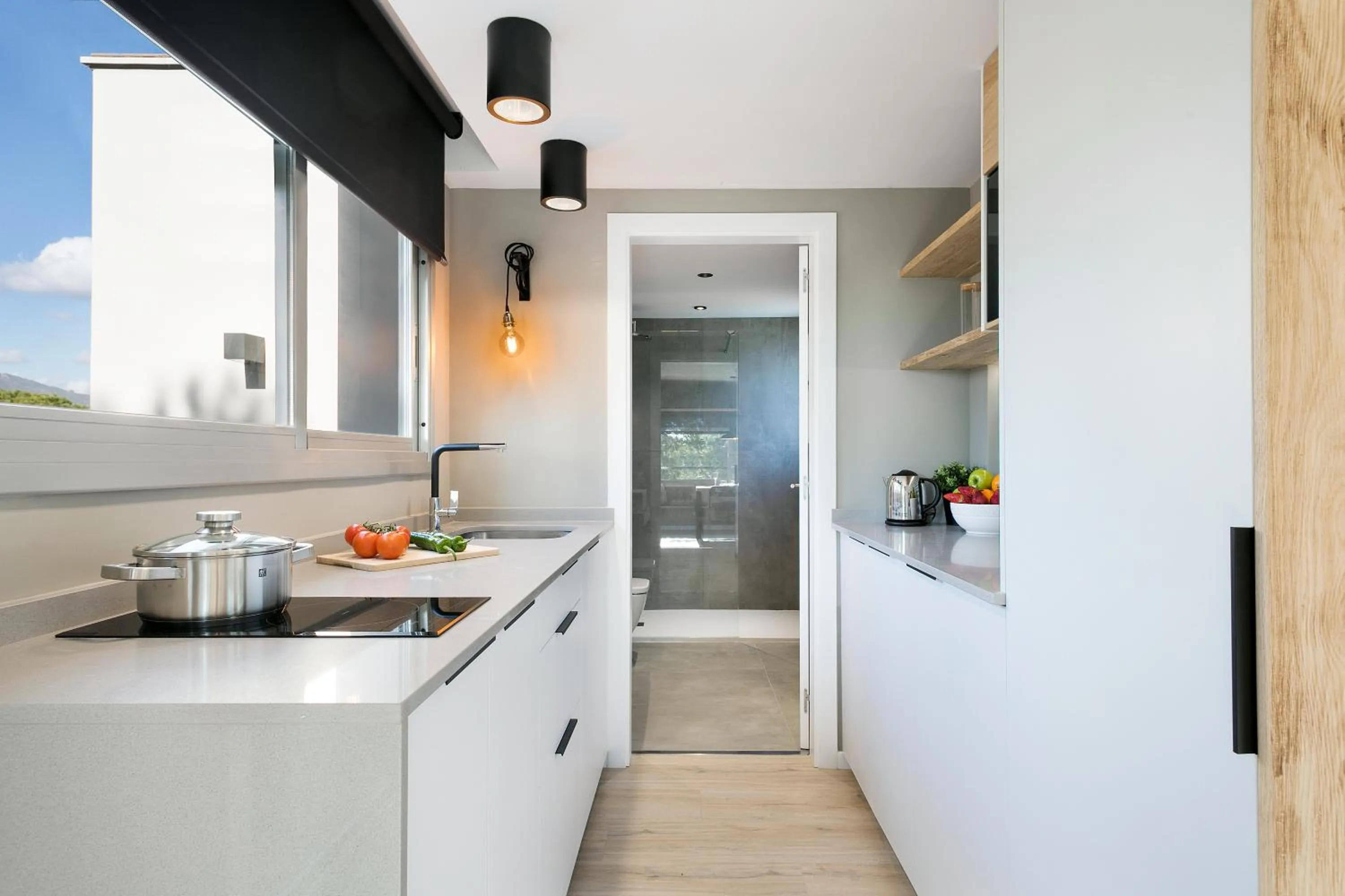 Kitchen or kitchenette in Apartamentos Porta Coeli