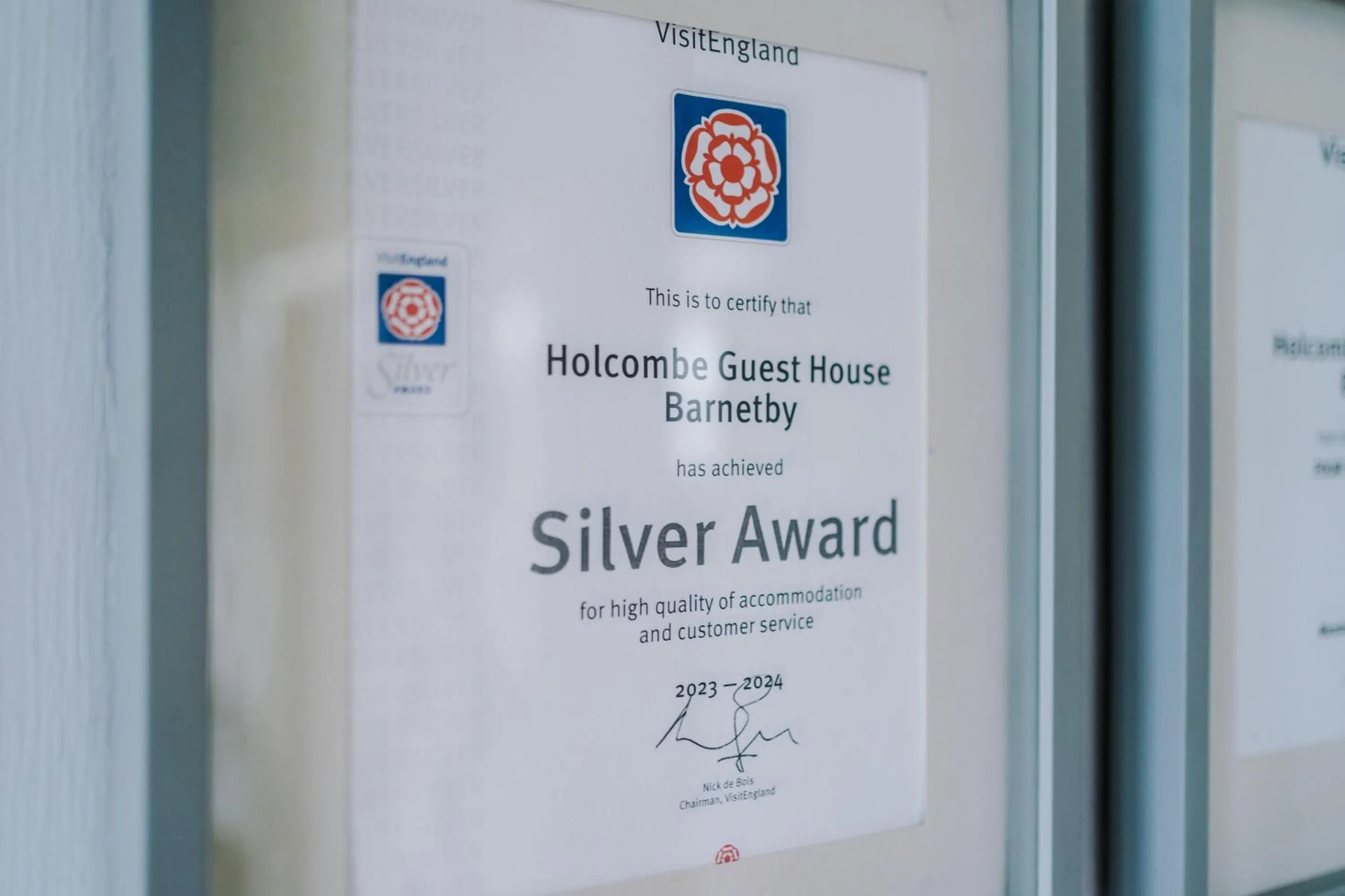 Property logo or sign in Holcombe Guest House