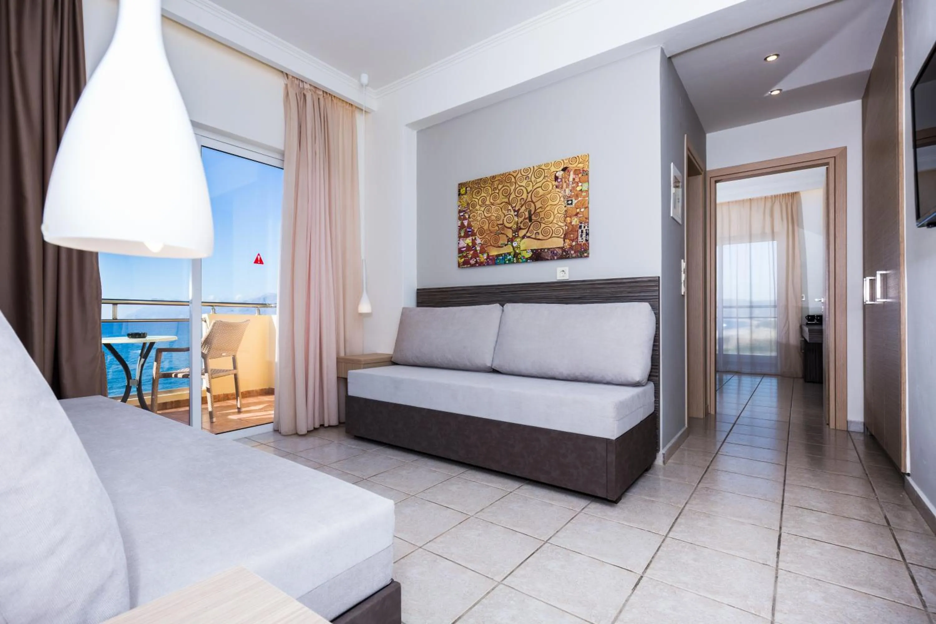 Seating area, Bed in Sunny Bay Hotel