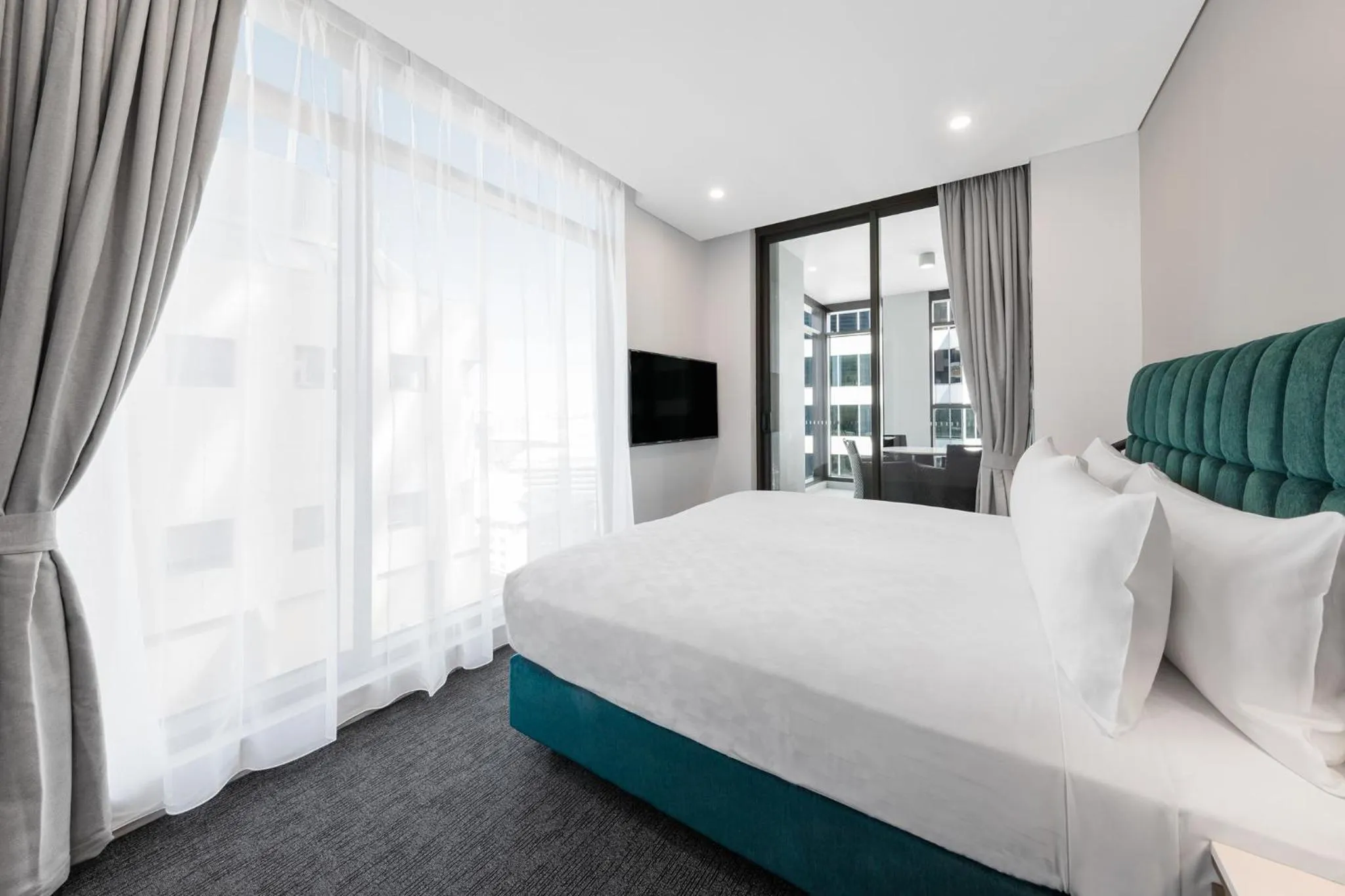 Bed in Meriton Suites Sussex Street, Sydney