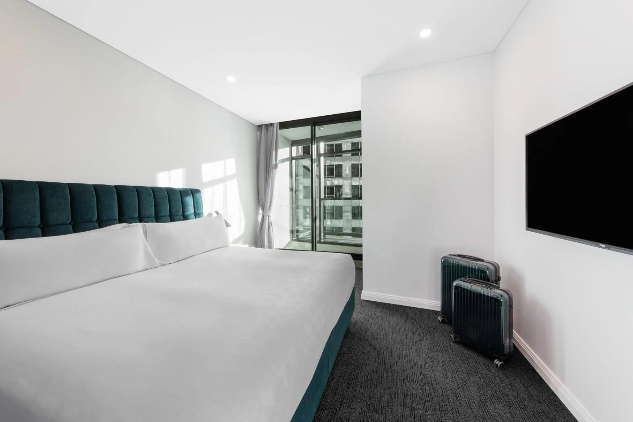 Bed in Meriton Suites Sussex Street, Sydney