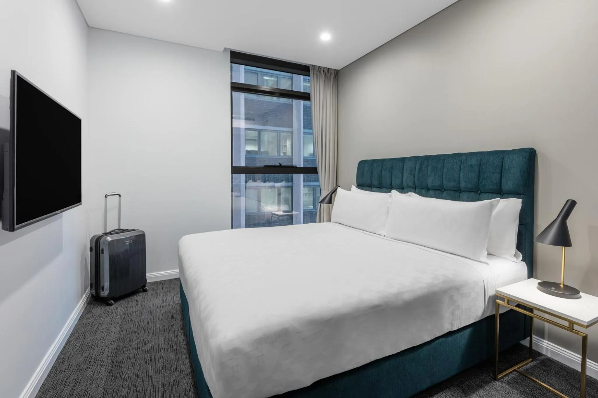 Bed in Meriton Suites Sussex Street, Sydney