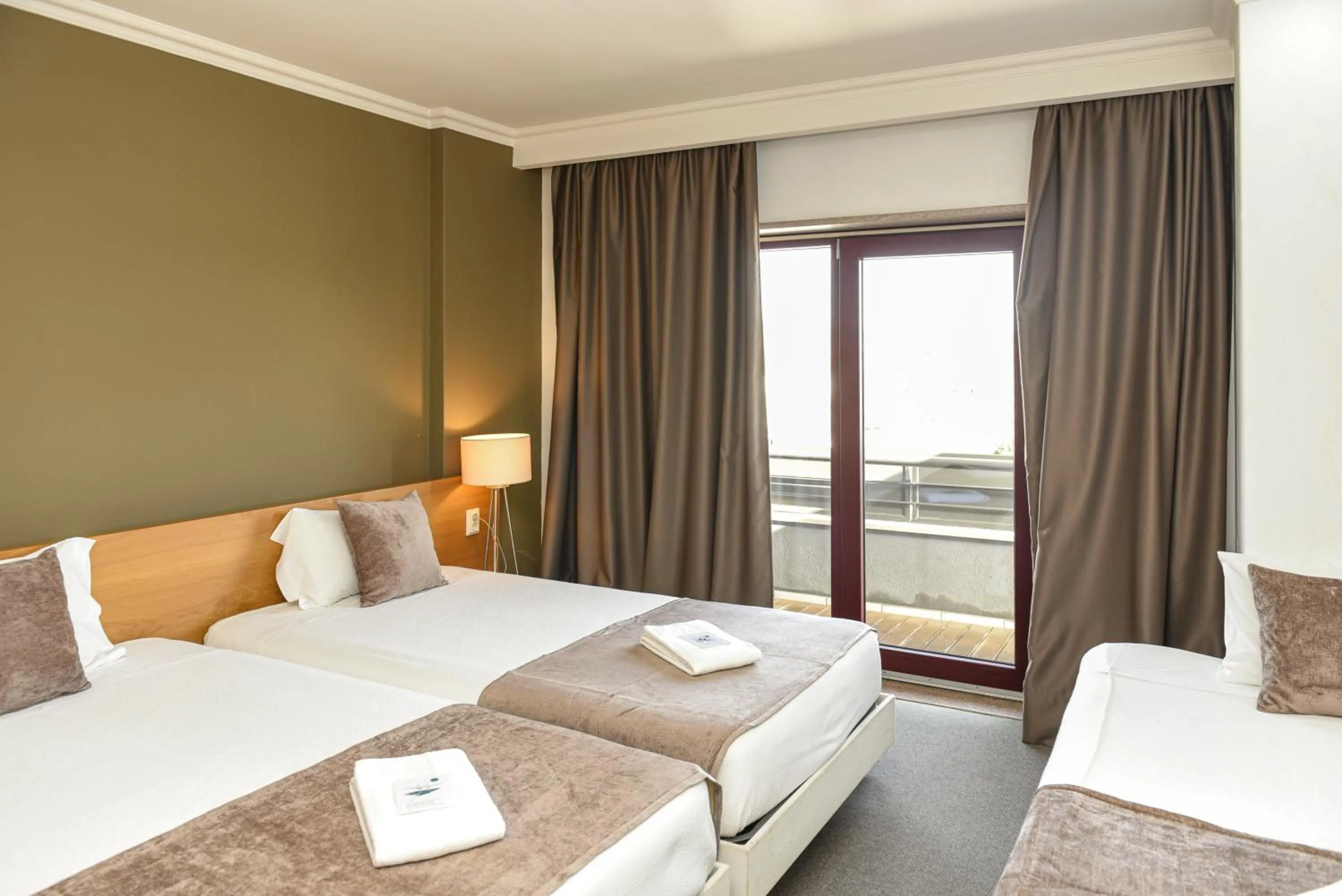 Bed in Dom Joao Hotel