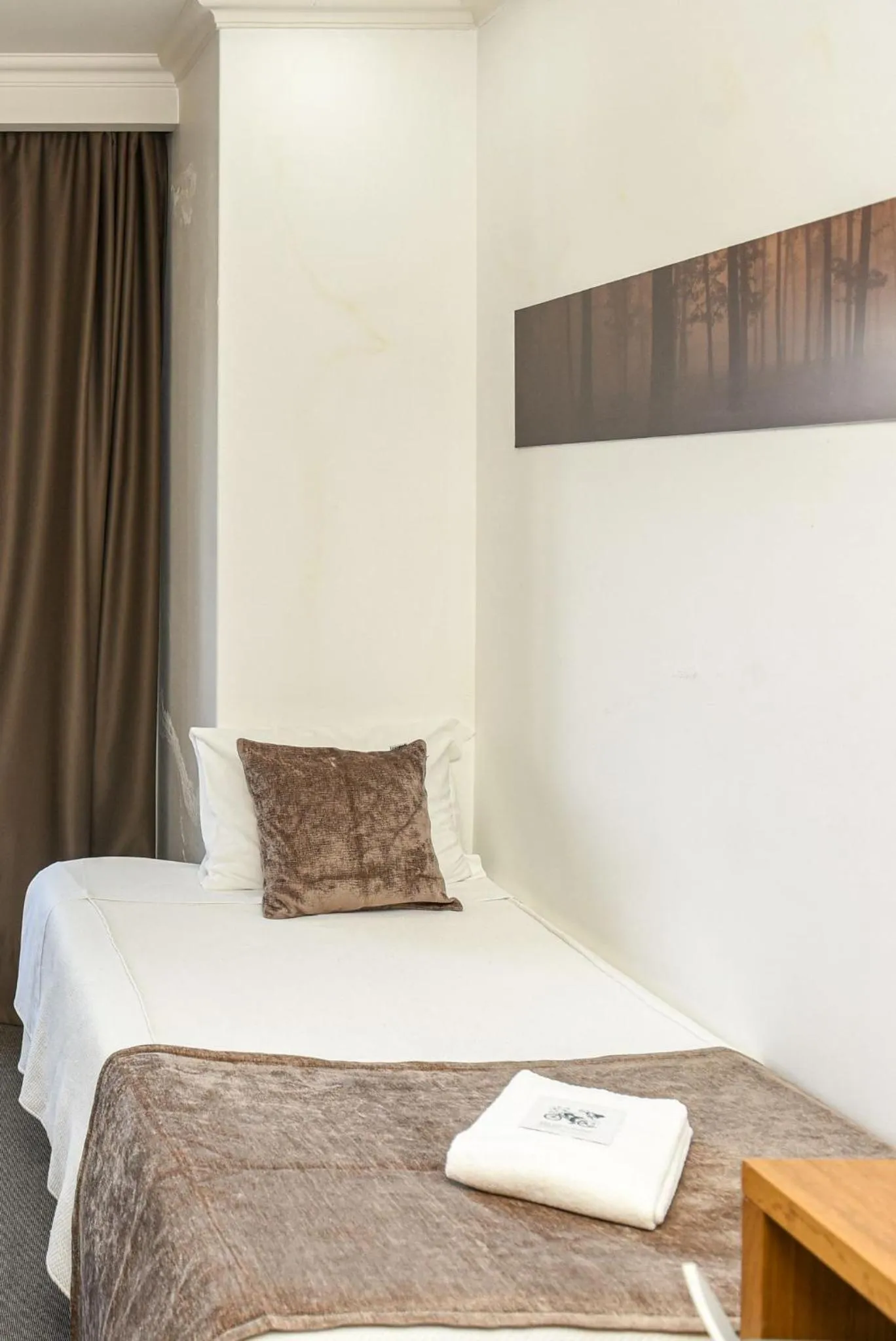 Bed in Dom Joao Hotel