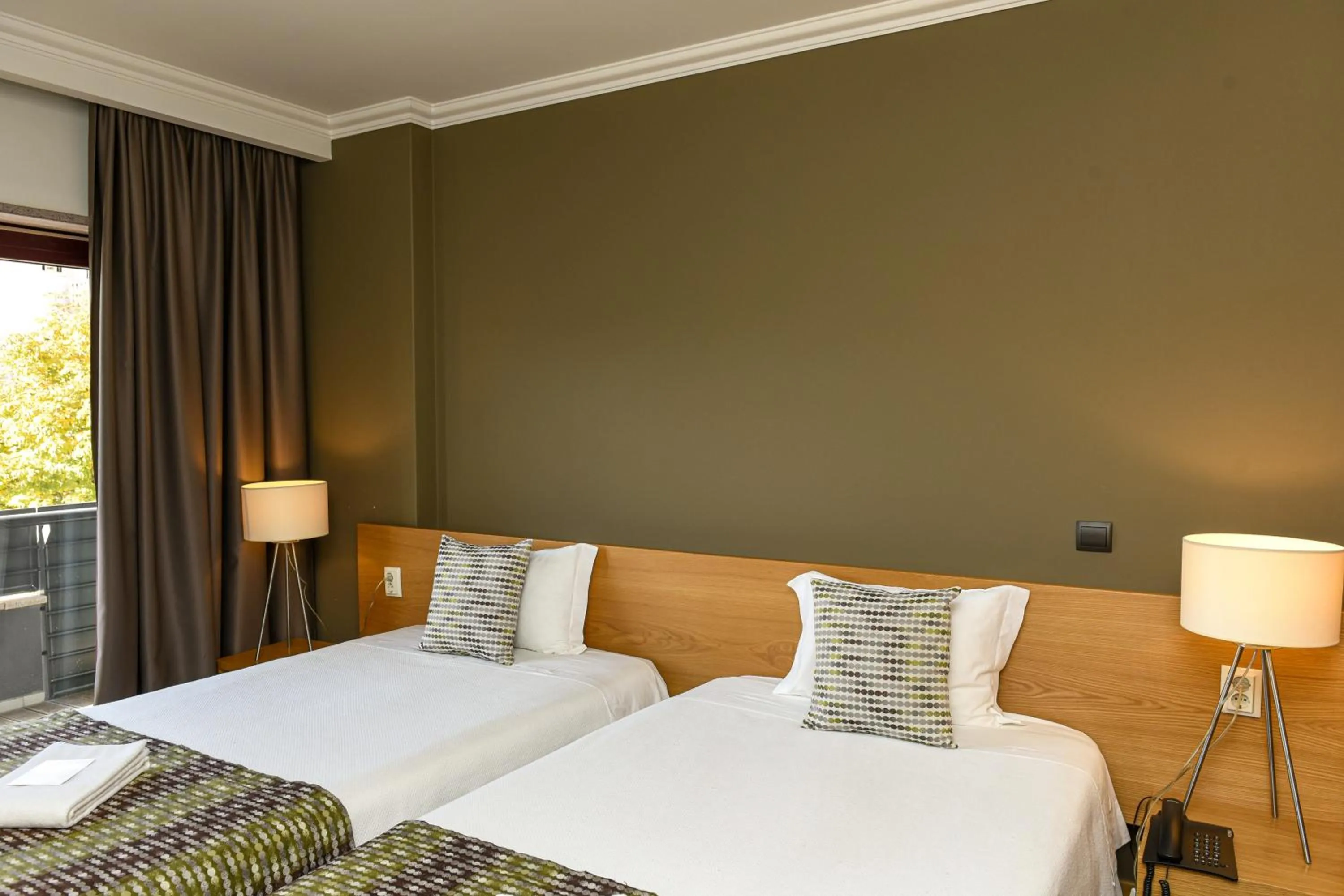 Bed in Dom Joao Hotel