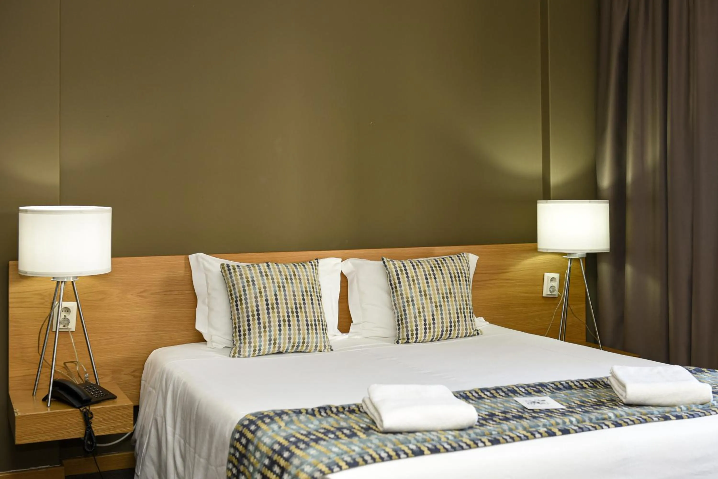 Bed in Dom Joao Hotel
