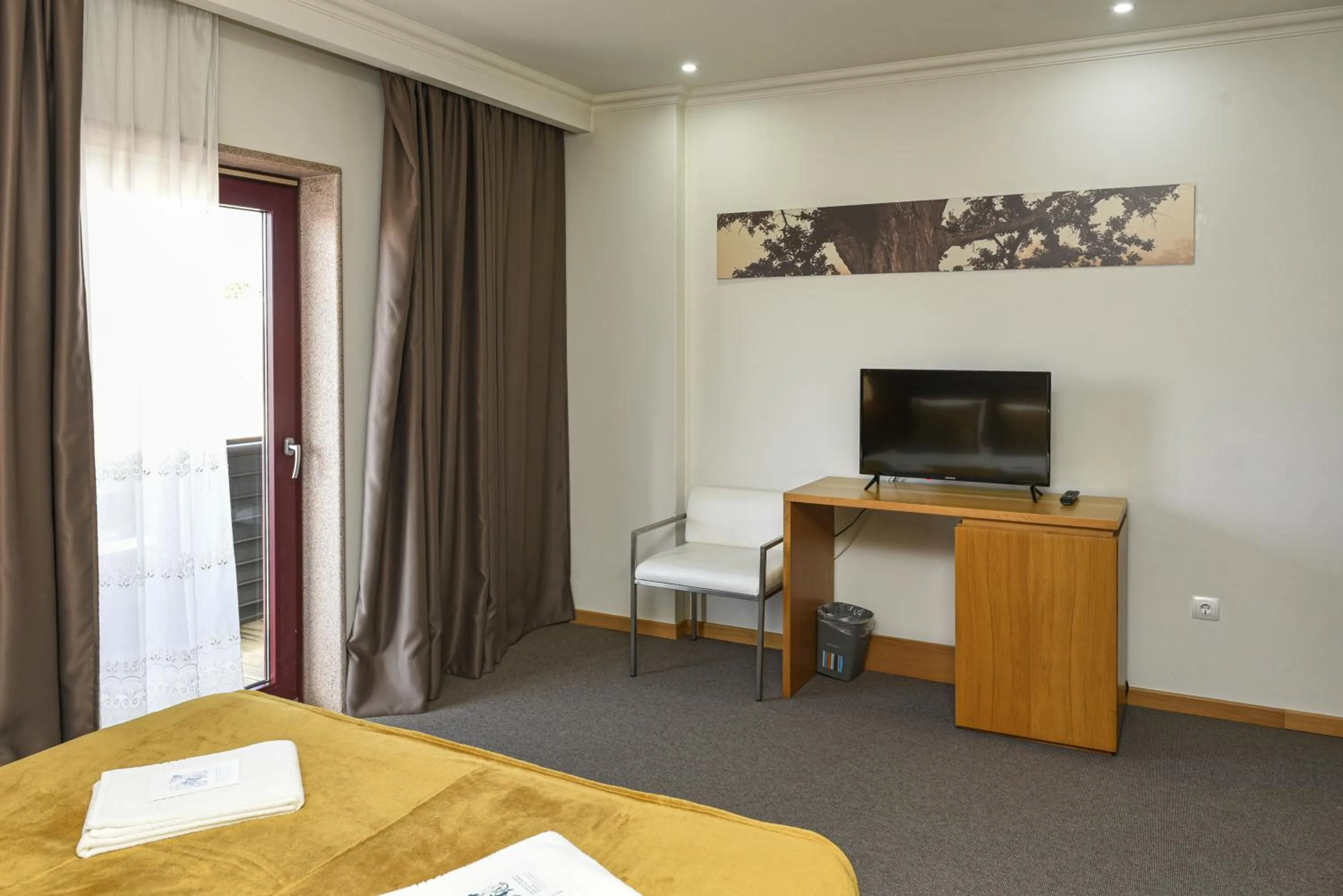 Bed in Dom Joao Hotel