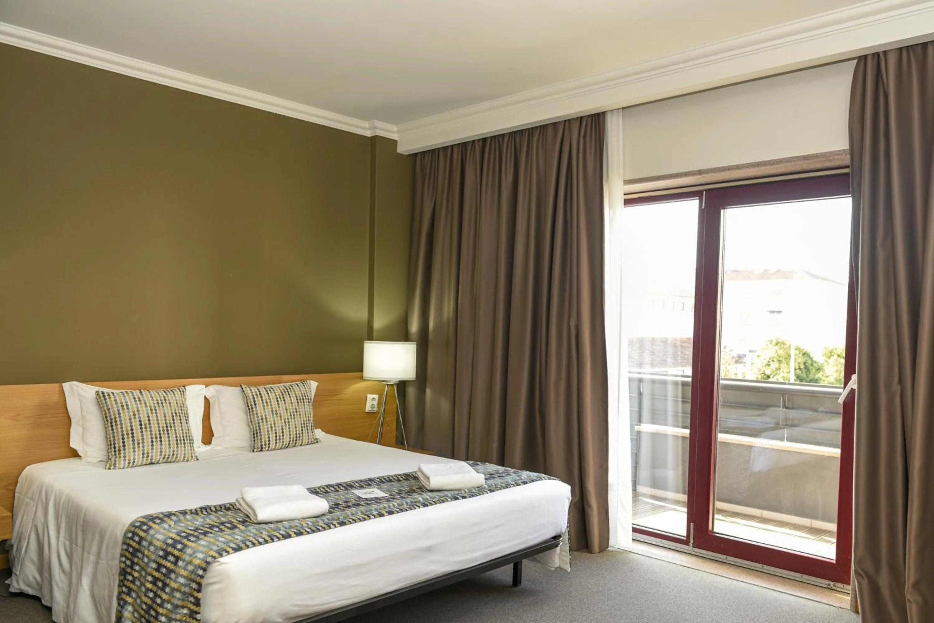 Bed in Dom Joao Hotel