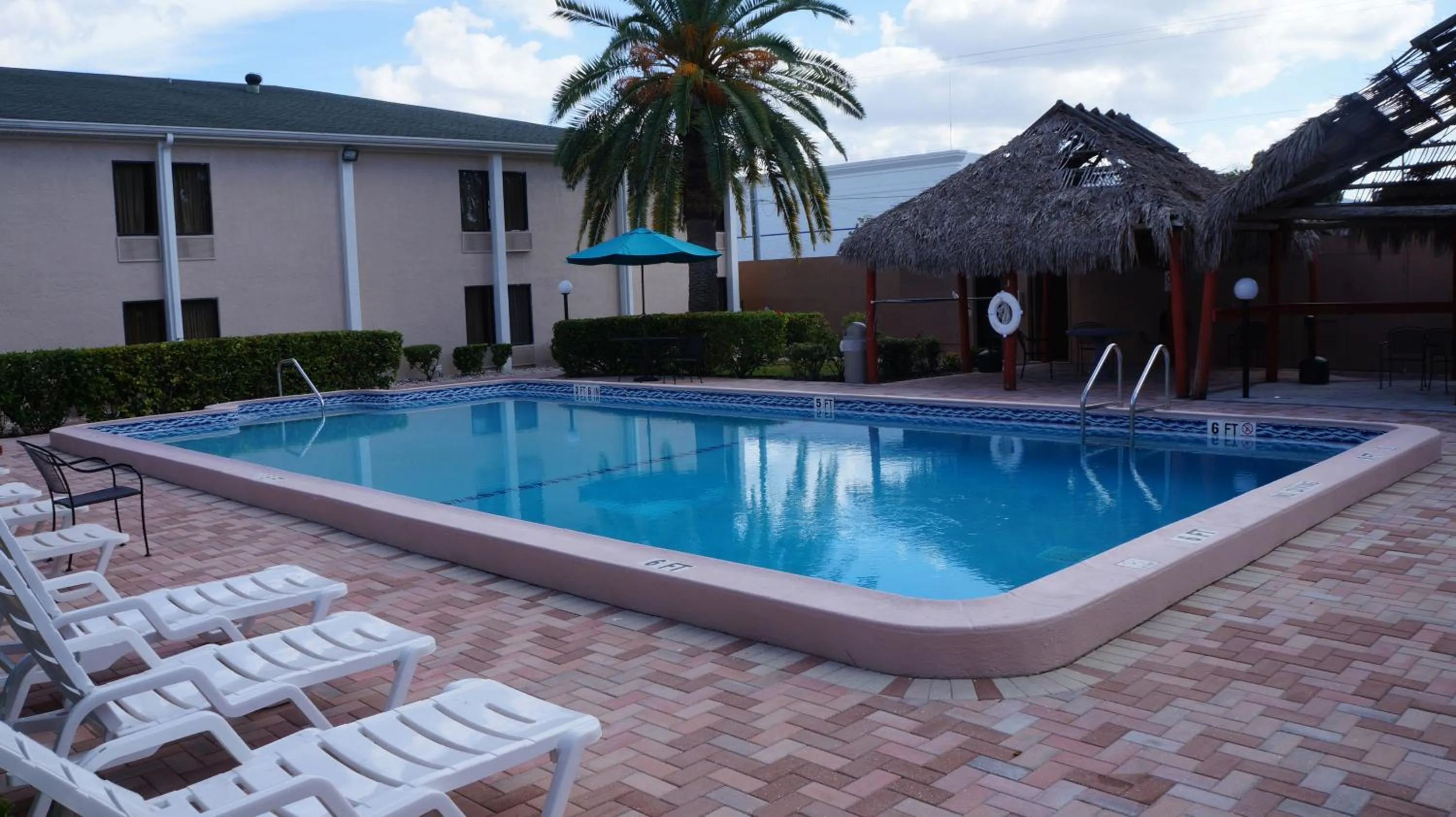 Swimming pool, Property Building in Travelodge by Wyndham Fort Myers