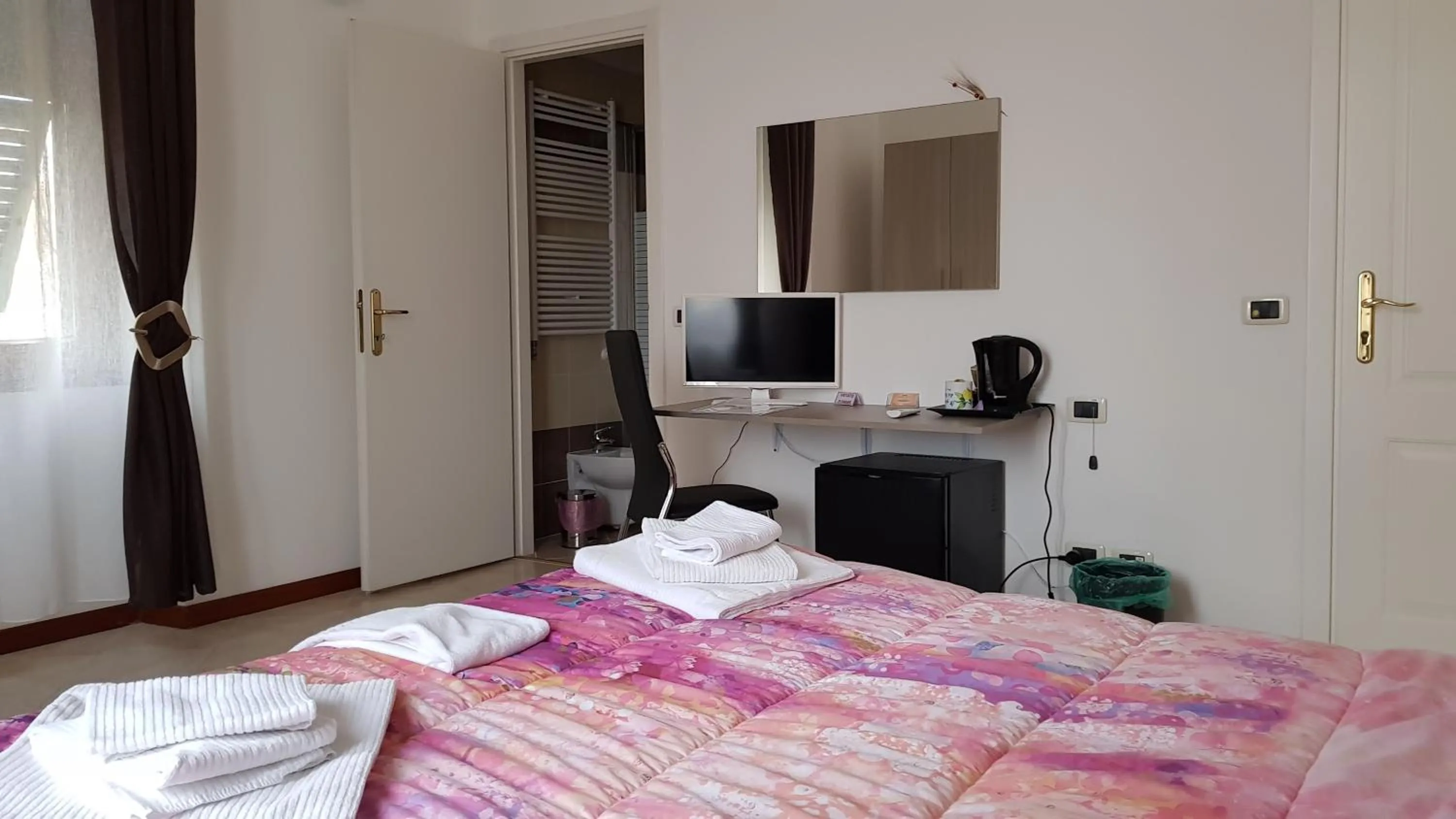 Bed in Il Giardino dei Limoni Room & Apartments