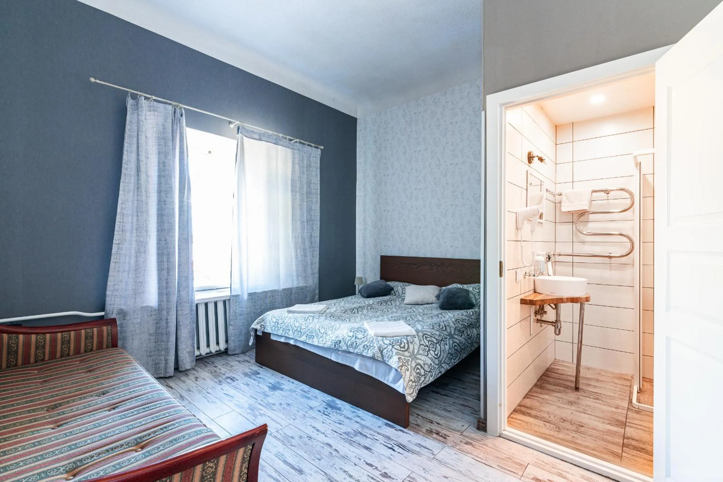 Bed in Godart Rooms Guesthouse