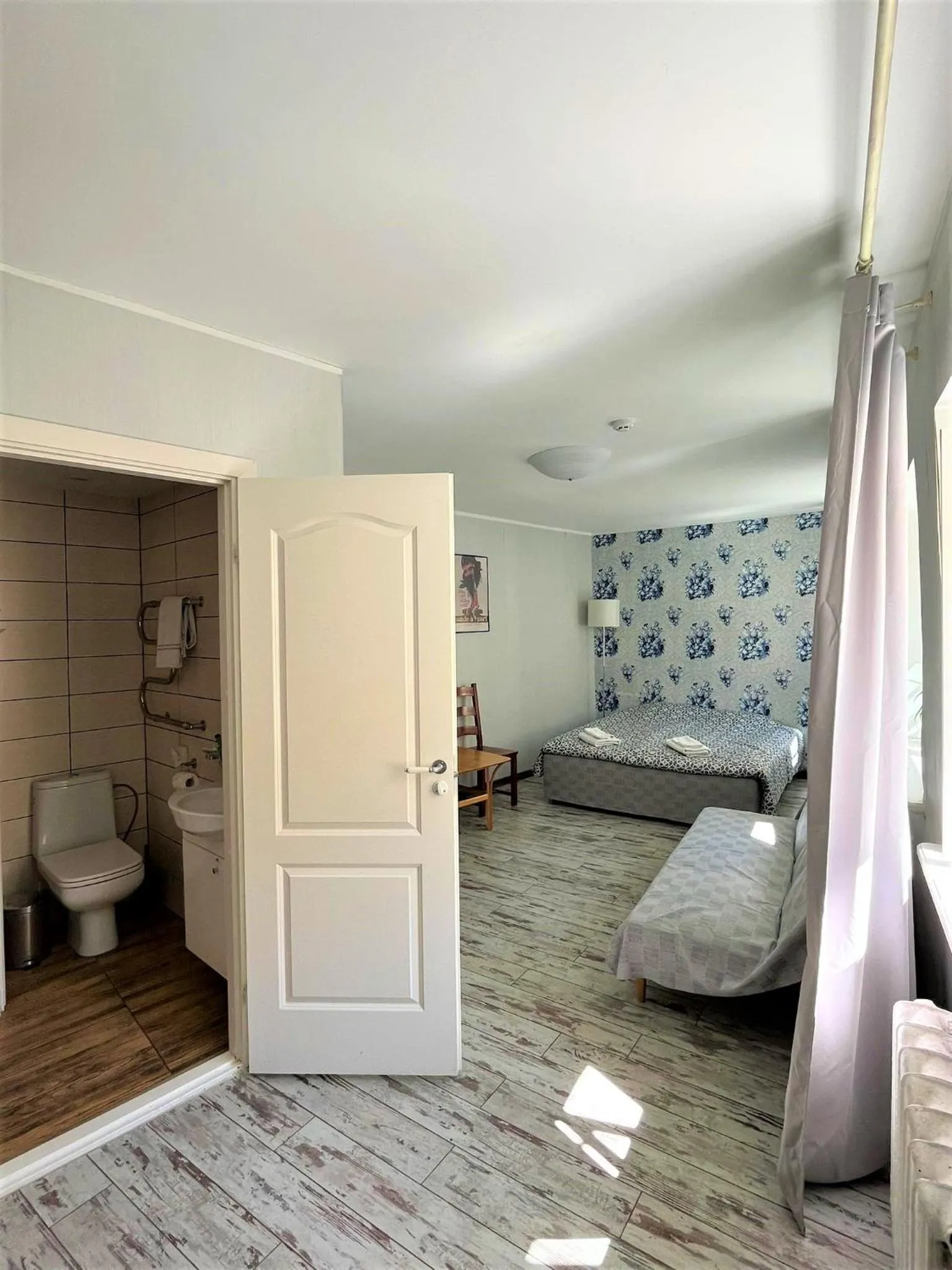 Bed in Godart Rooms Guesthouse