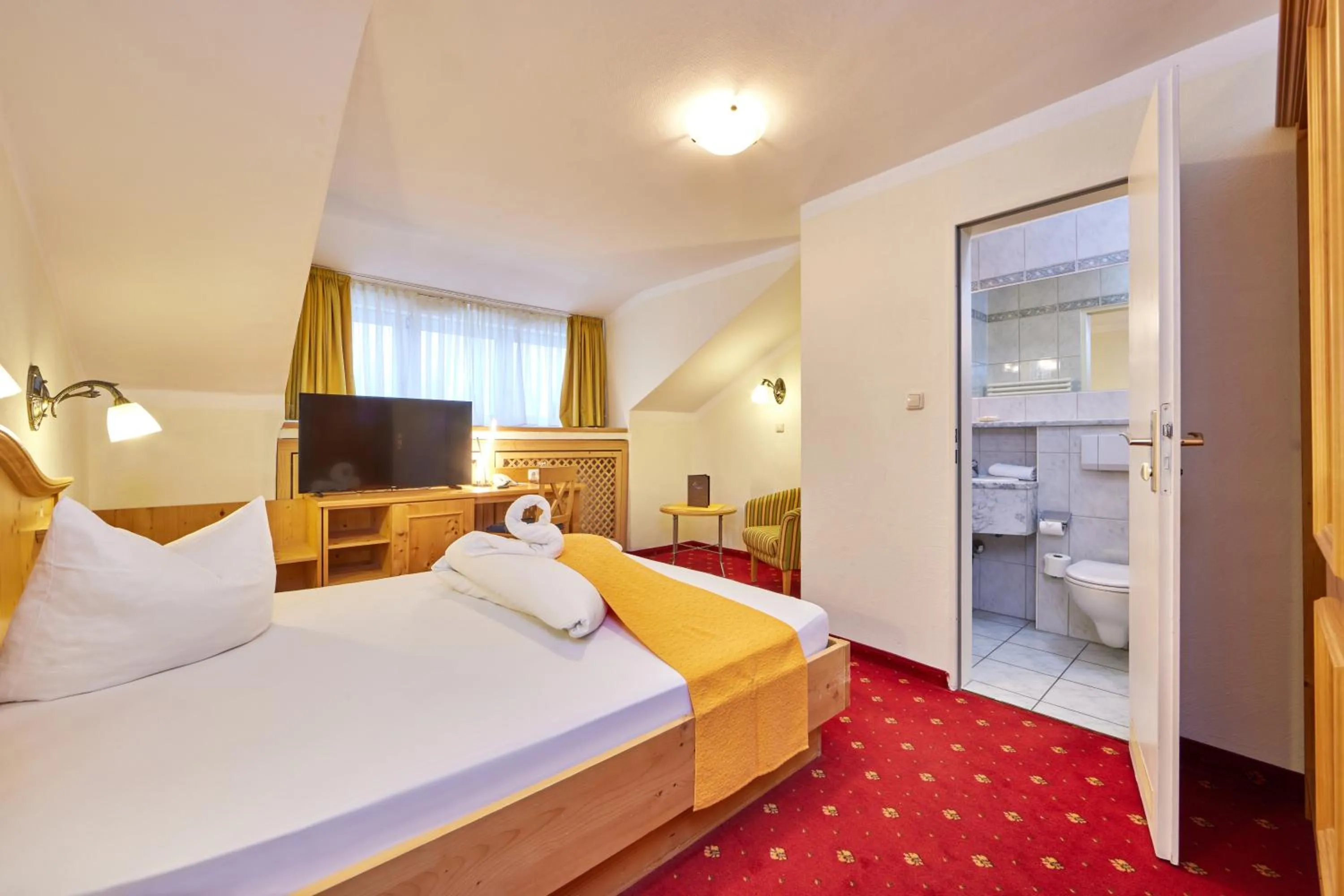 Bed in Alpenhotel Rieger