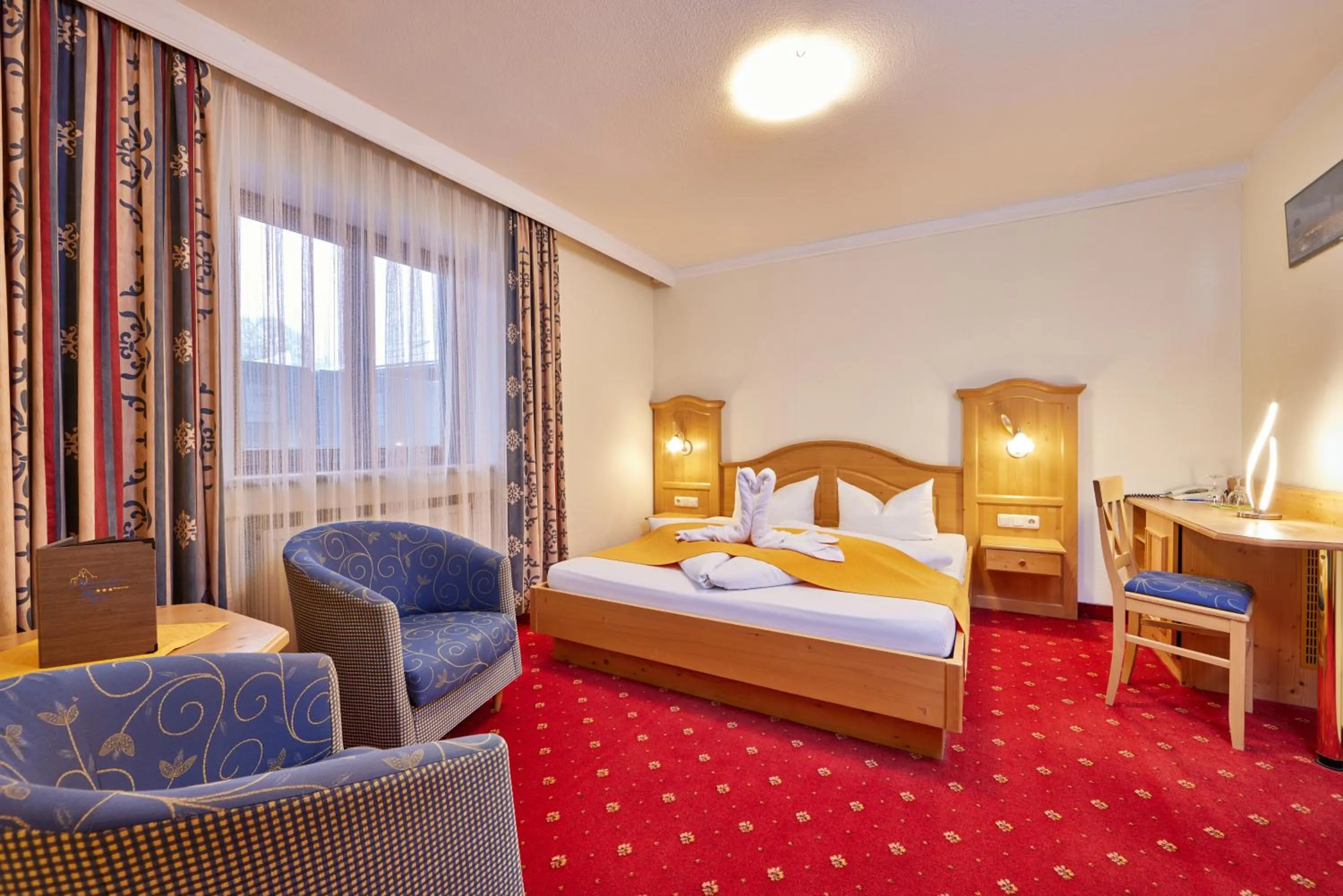 Bed in Alpenhotel Rieger