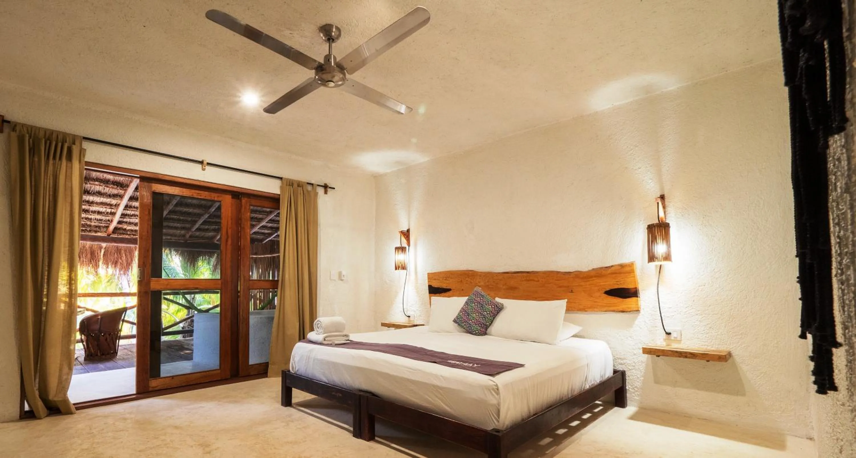 Bed in Zomay Beachfront Holbox