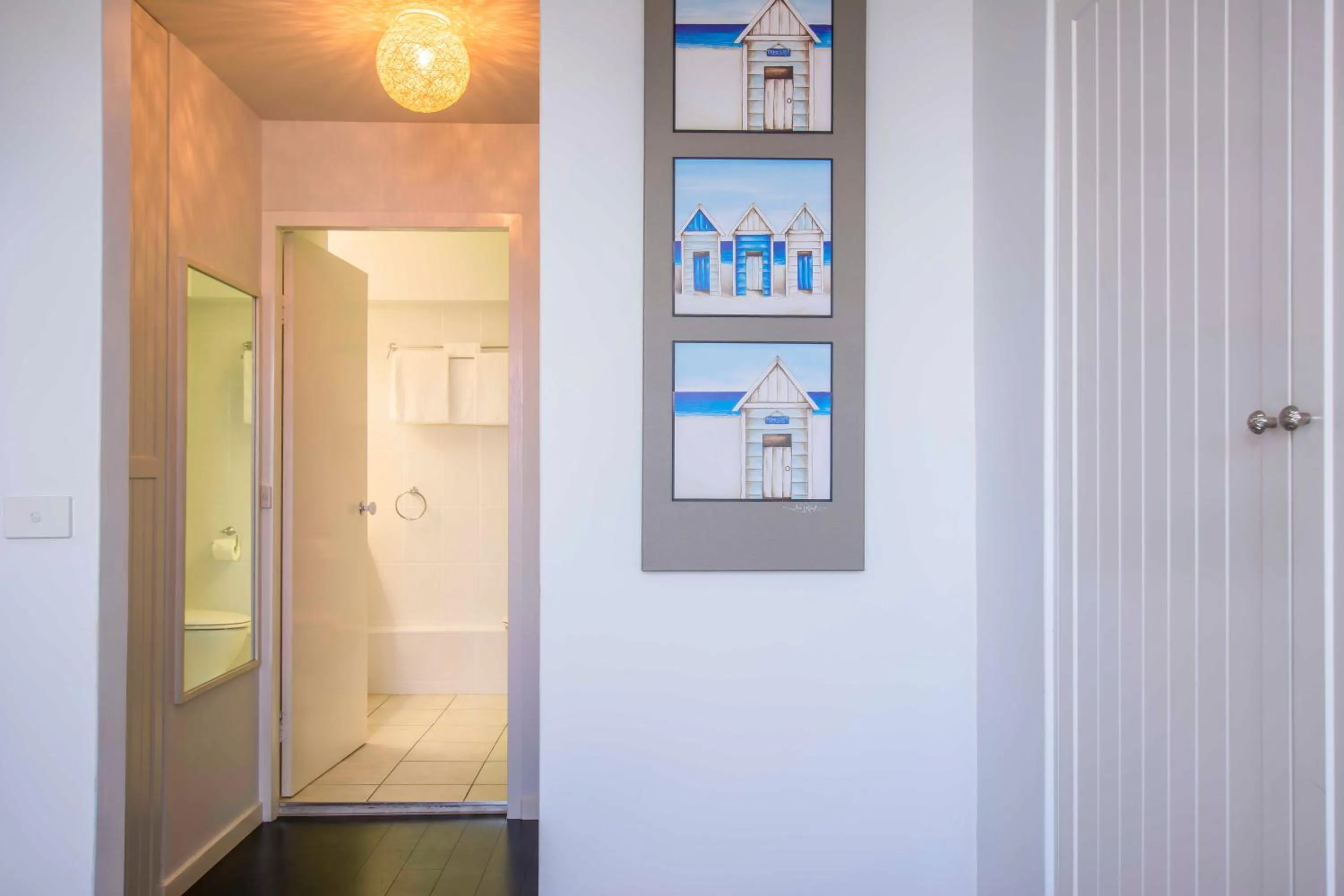 Bathroom in 84 The Spit Holiday Apartments