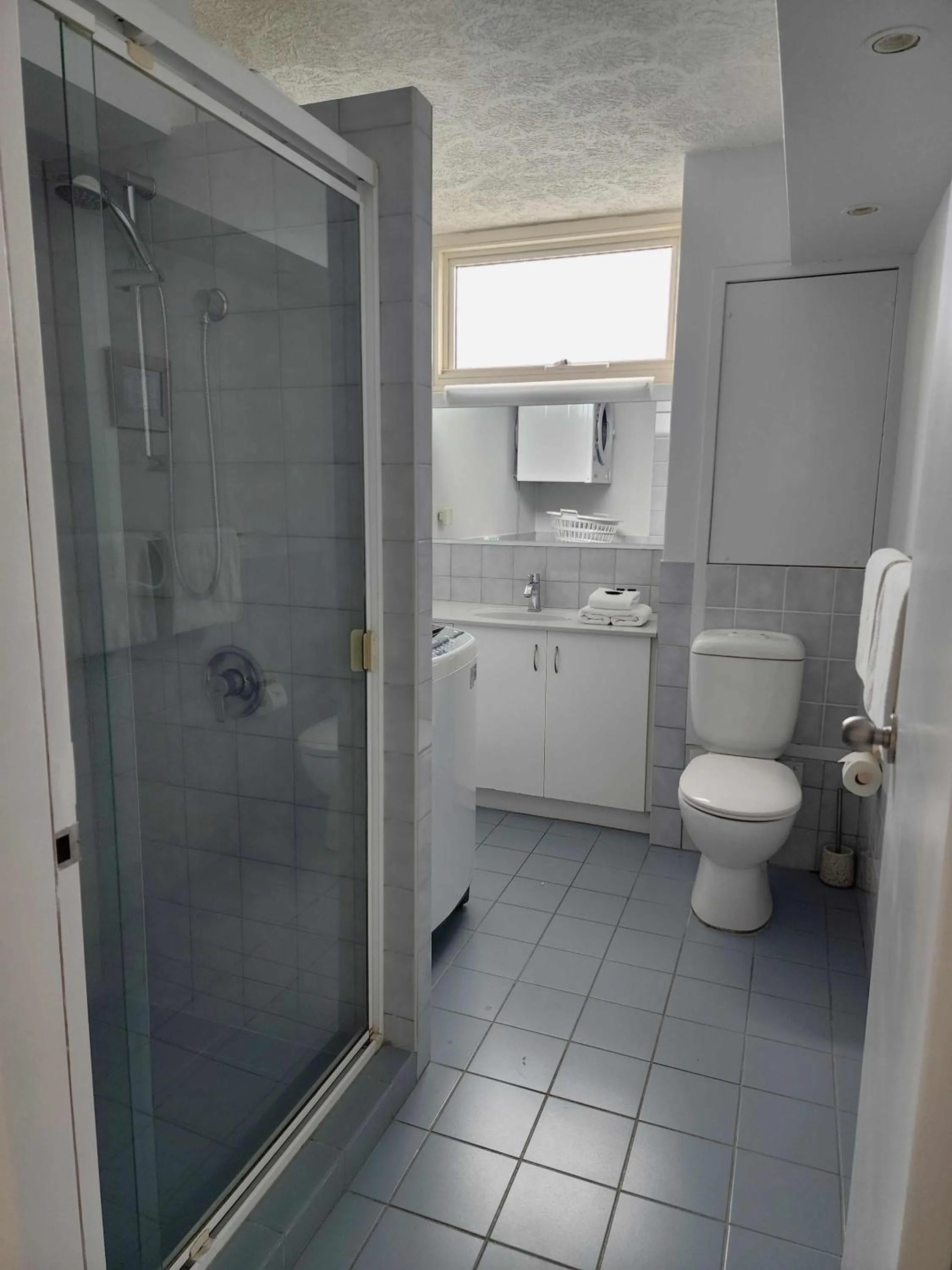 Bathroom in 84 The Spit Holiday Apartments